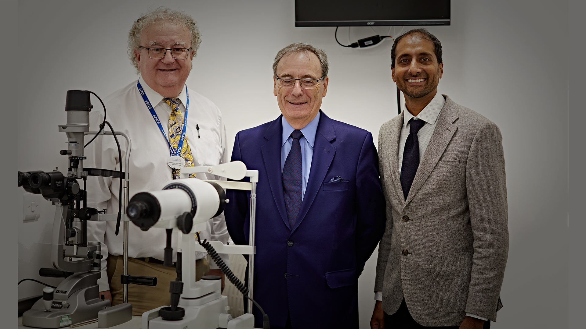 Professor John Siderov, Head of the Department of Optometry and Vision Sciences is pictured far left with the University's Chancellor Sir George Buckley (centre) and Moin Valli, the managing director of Valli Opticians