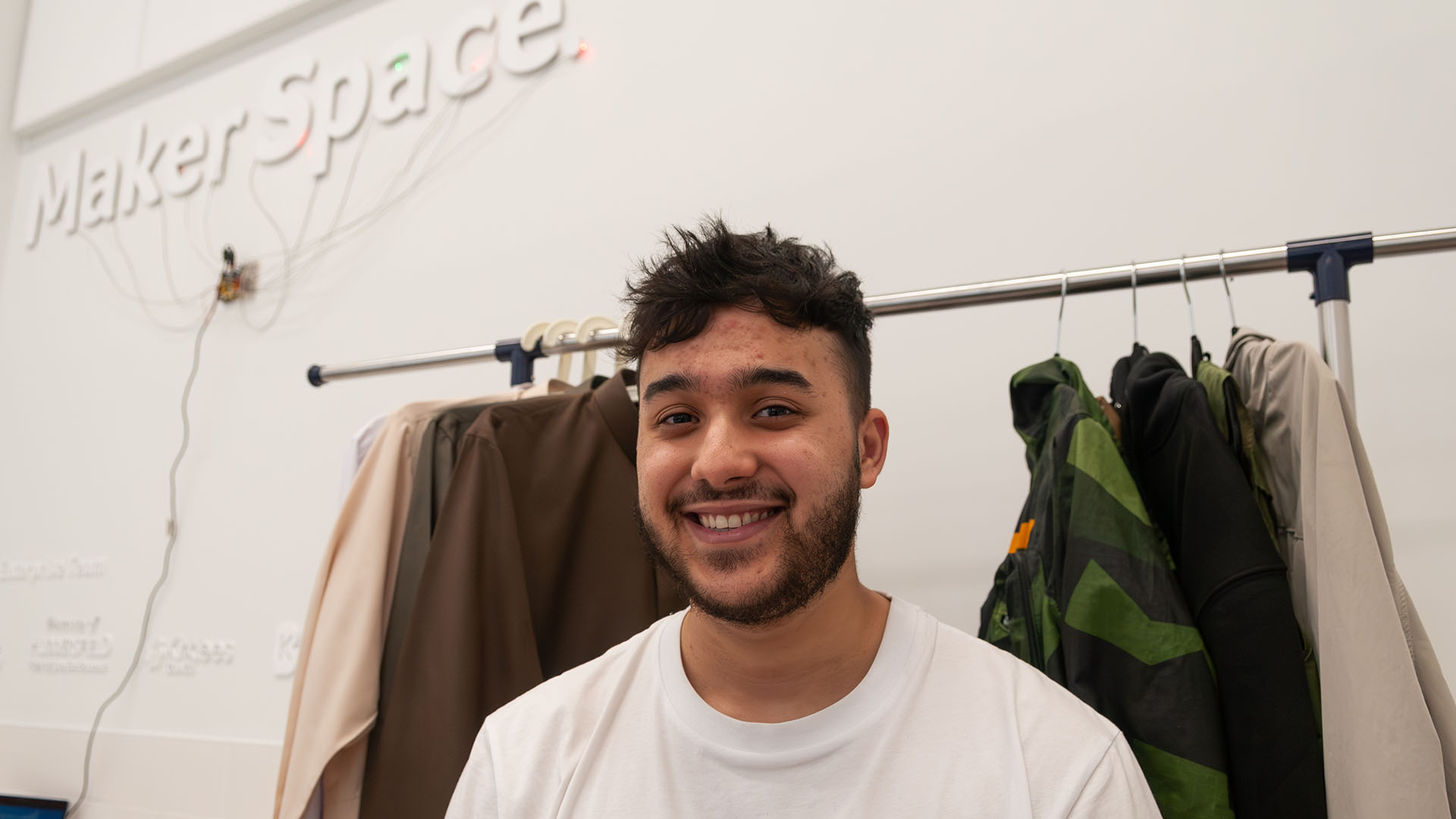 A student smiles at the camera