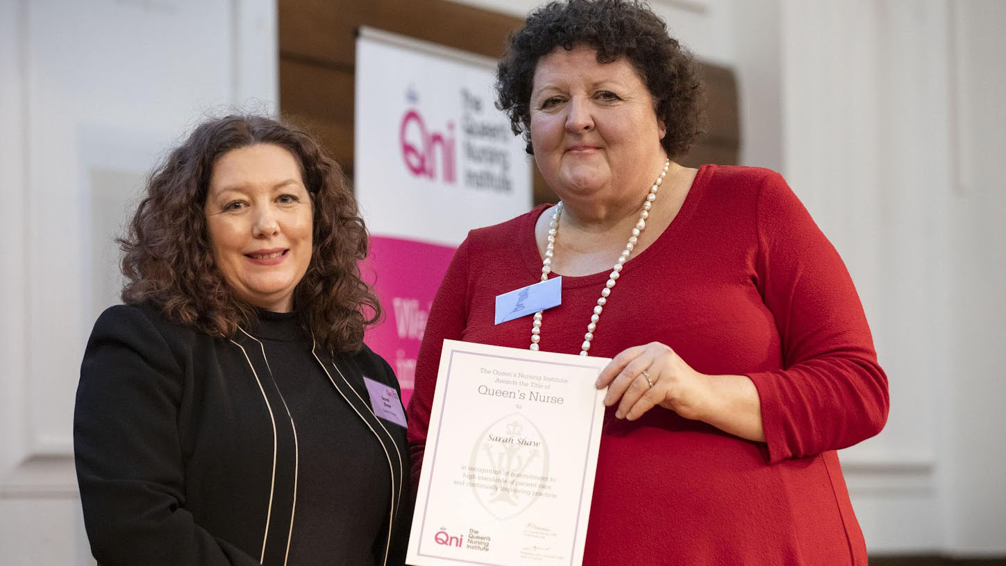 Sarah Shaw with an award and Professor Deborah Sturdy