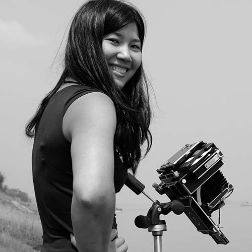 Yan Preston holding a camera