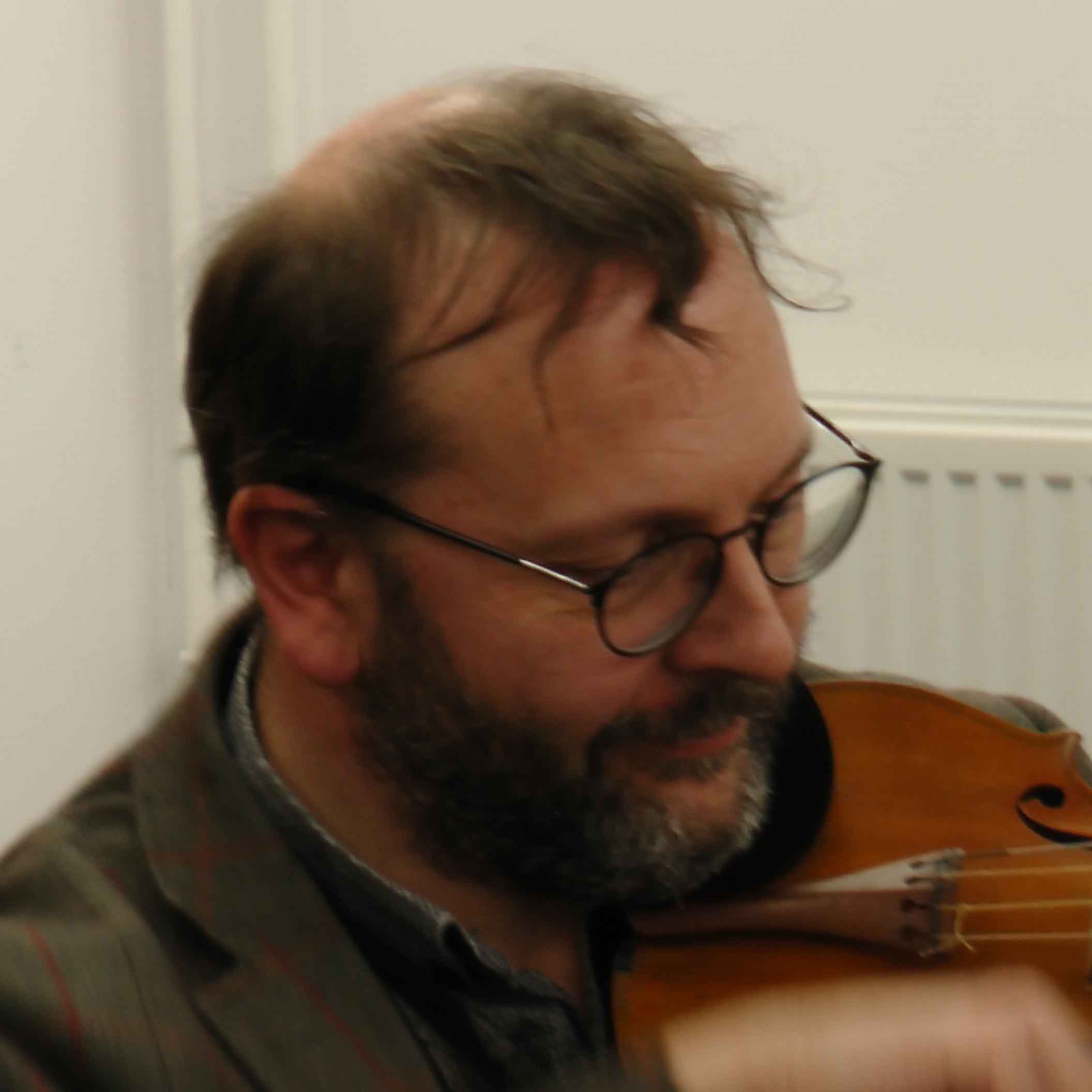 David Milsom plays a violin