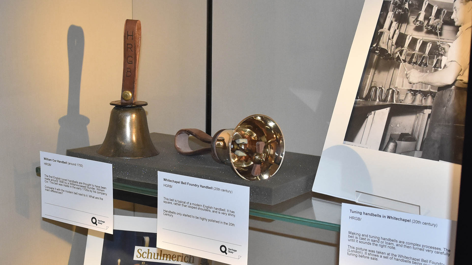 Some artefacts in a cabinet from an exhibition about handbells
