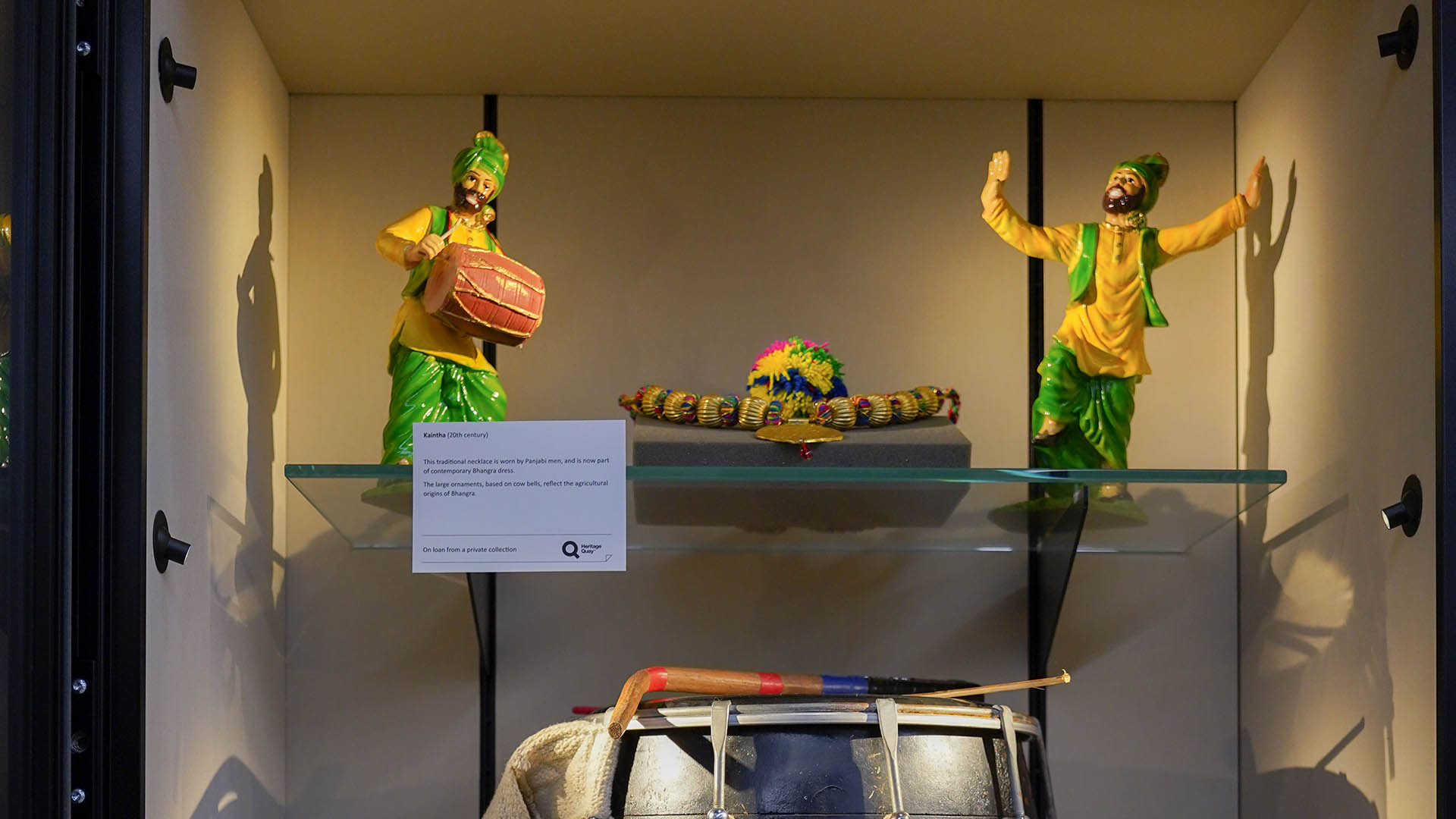 Some bhangra items in a glass case