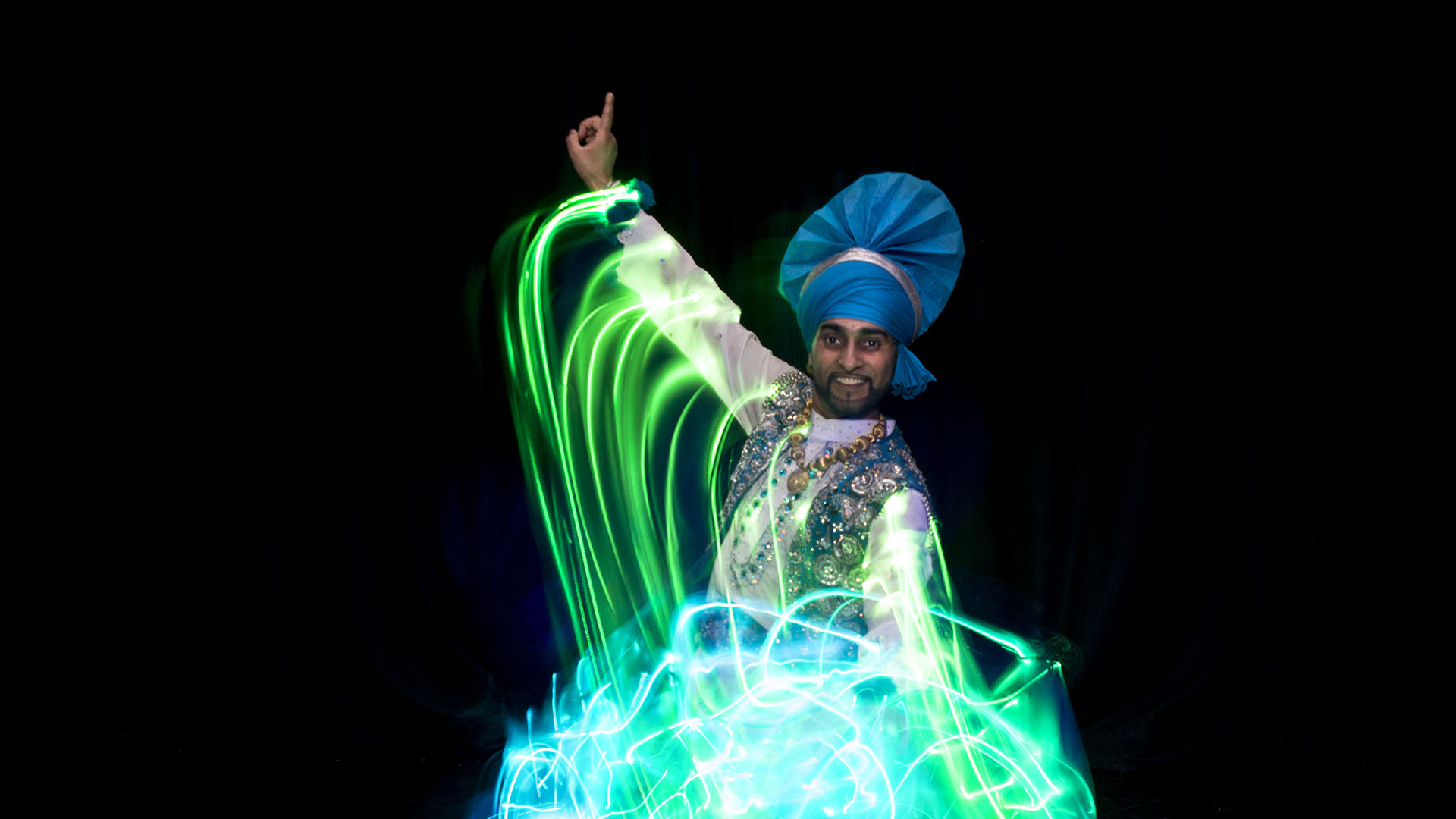 A bhangra dancer with light trails