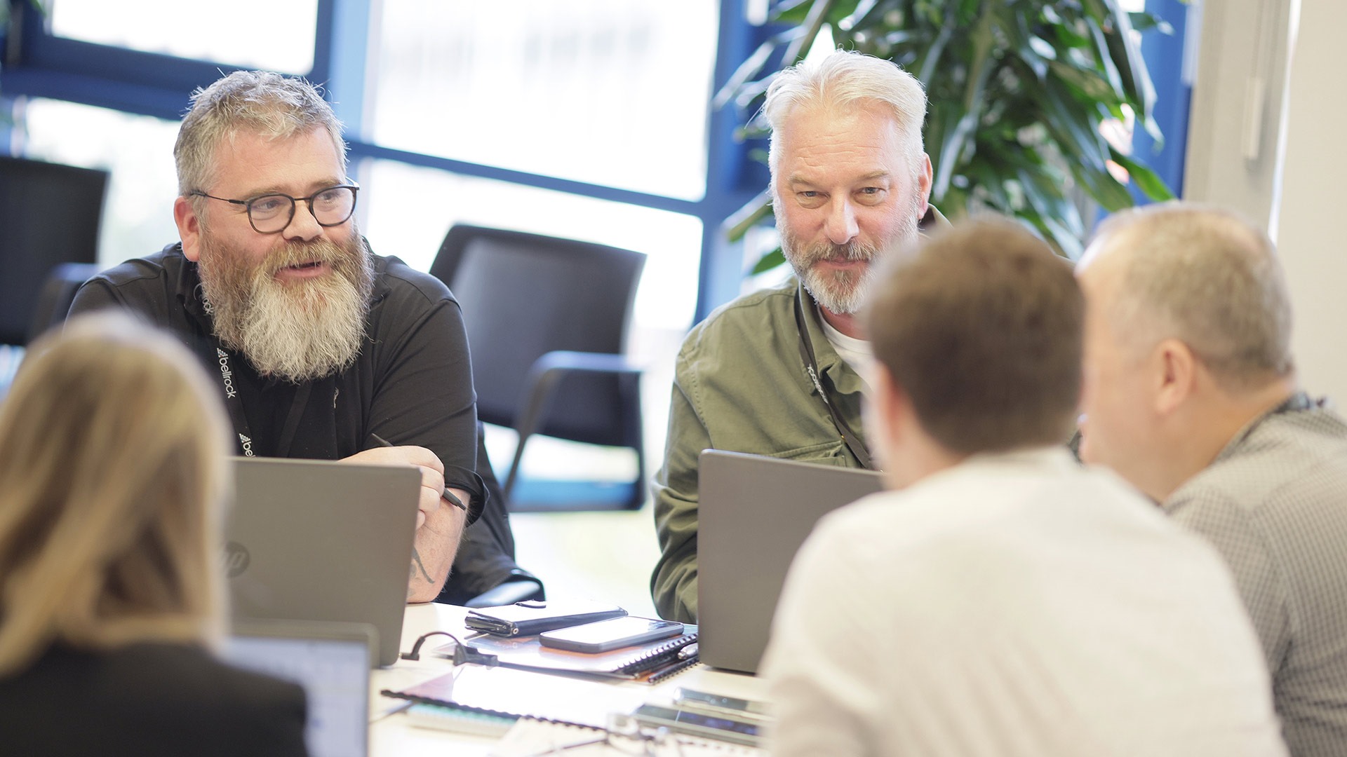 A group sat round a table in an office