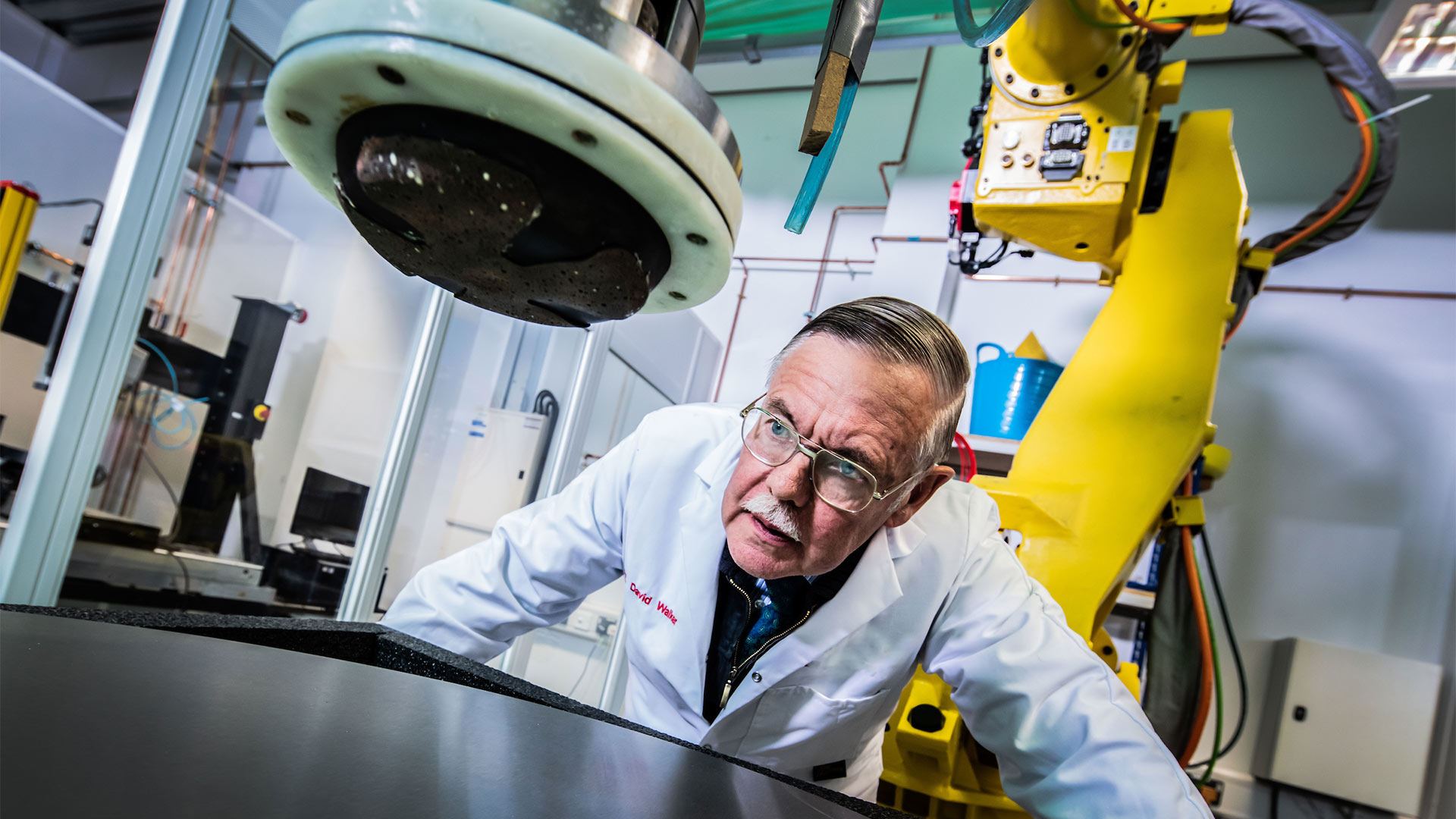 Professor David Walker inspecting equipment in a laboratory