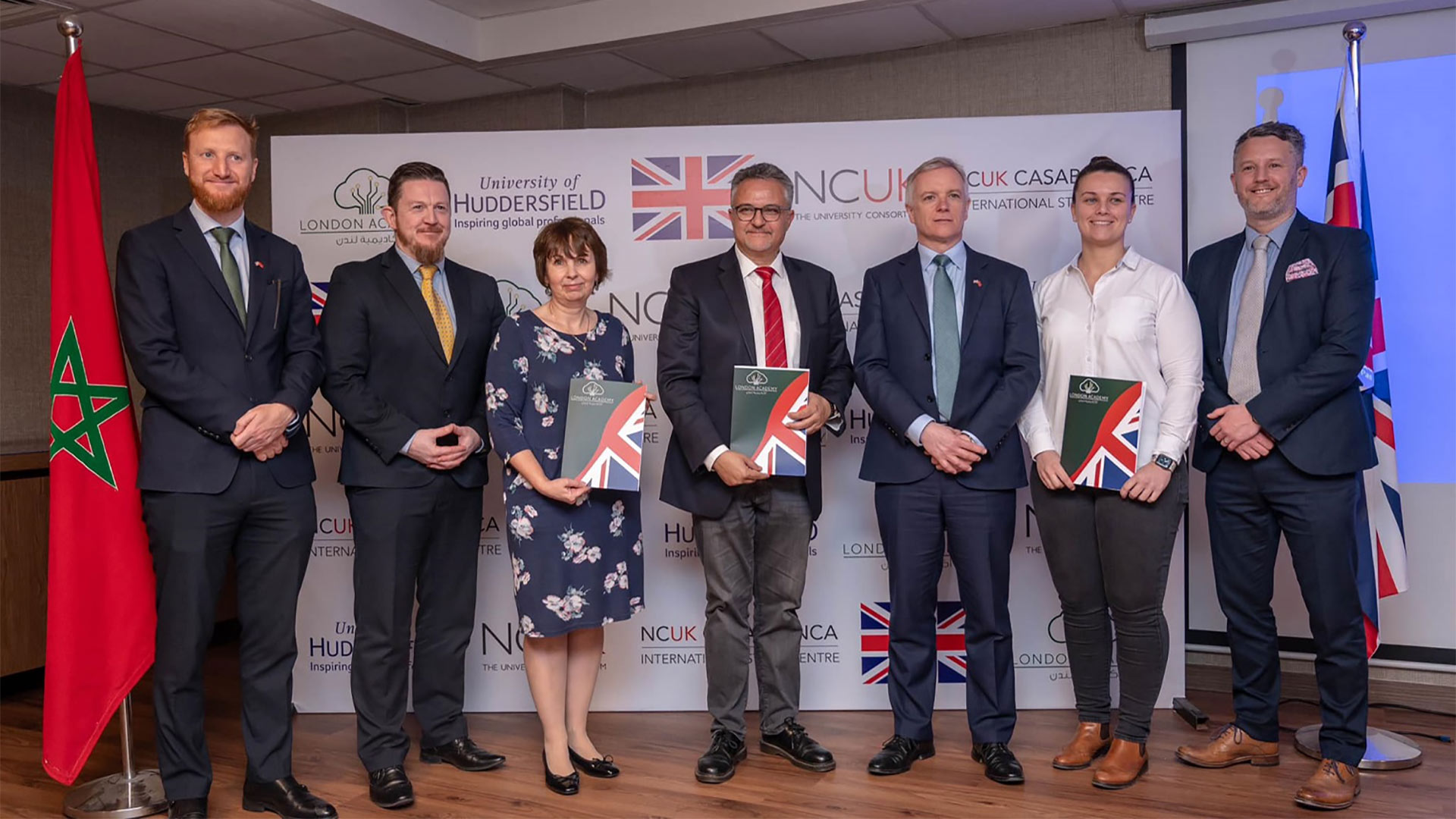 A group of men and women including representatives from University of Huddersfield