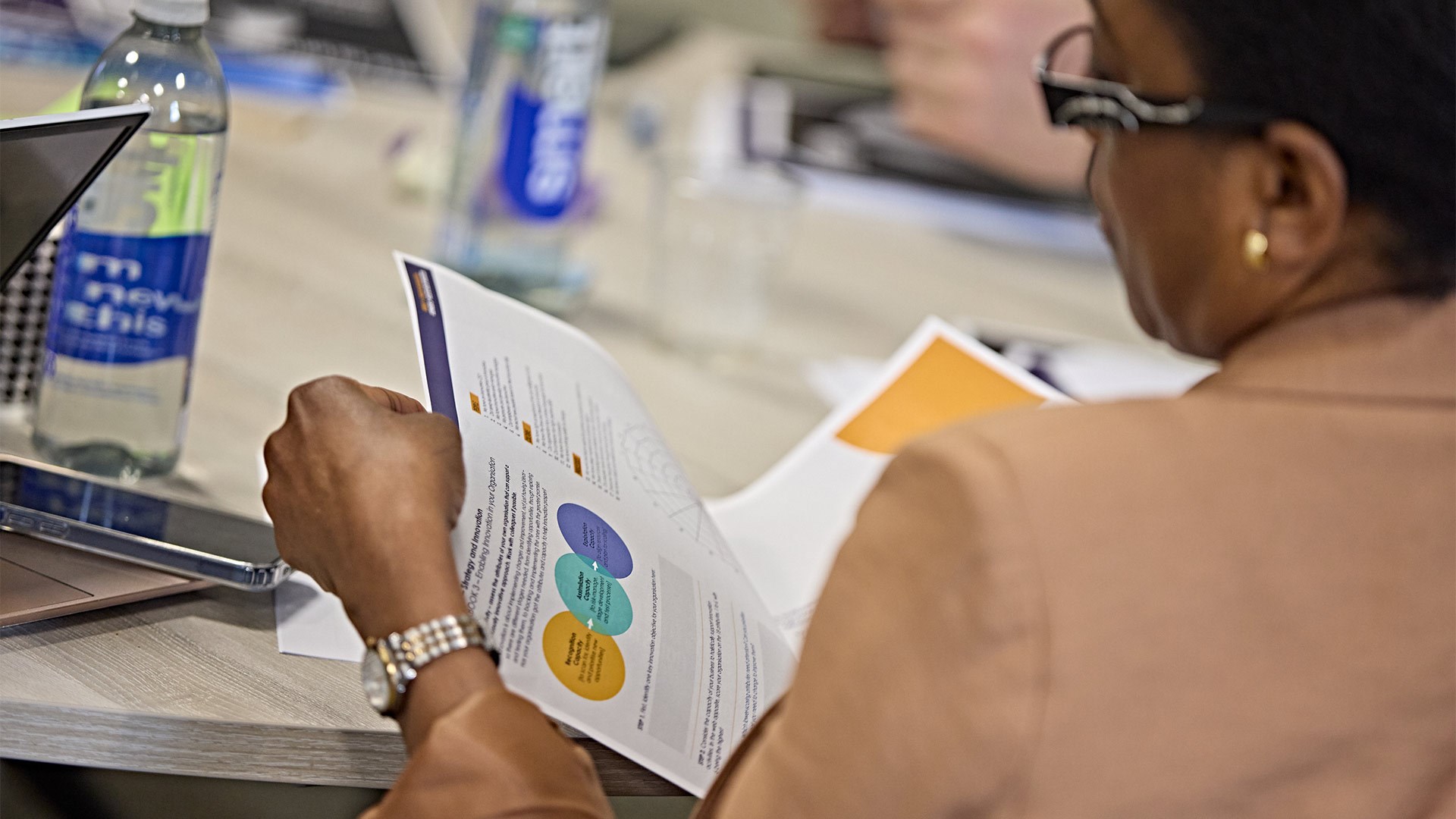 A woman looking through a pamphlet
