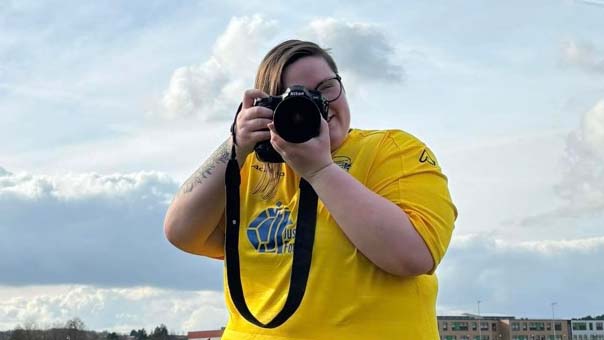 Kairen Clarke shoots through a camera