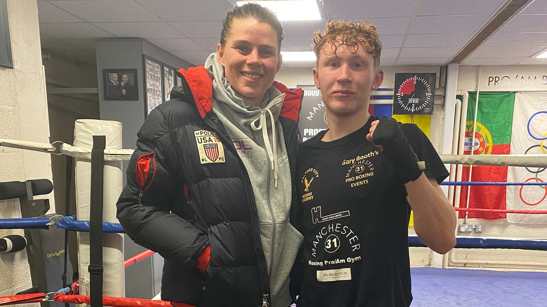 Savannah Marshall on the left standing next to Wayde Griffin in a boxing gym