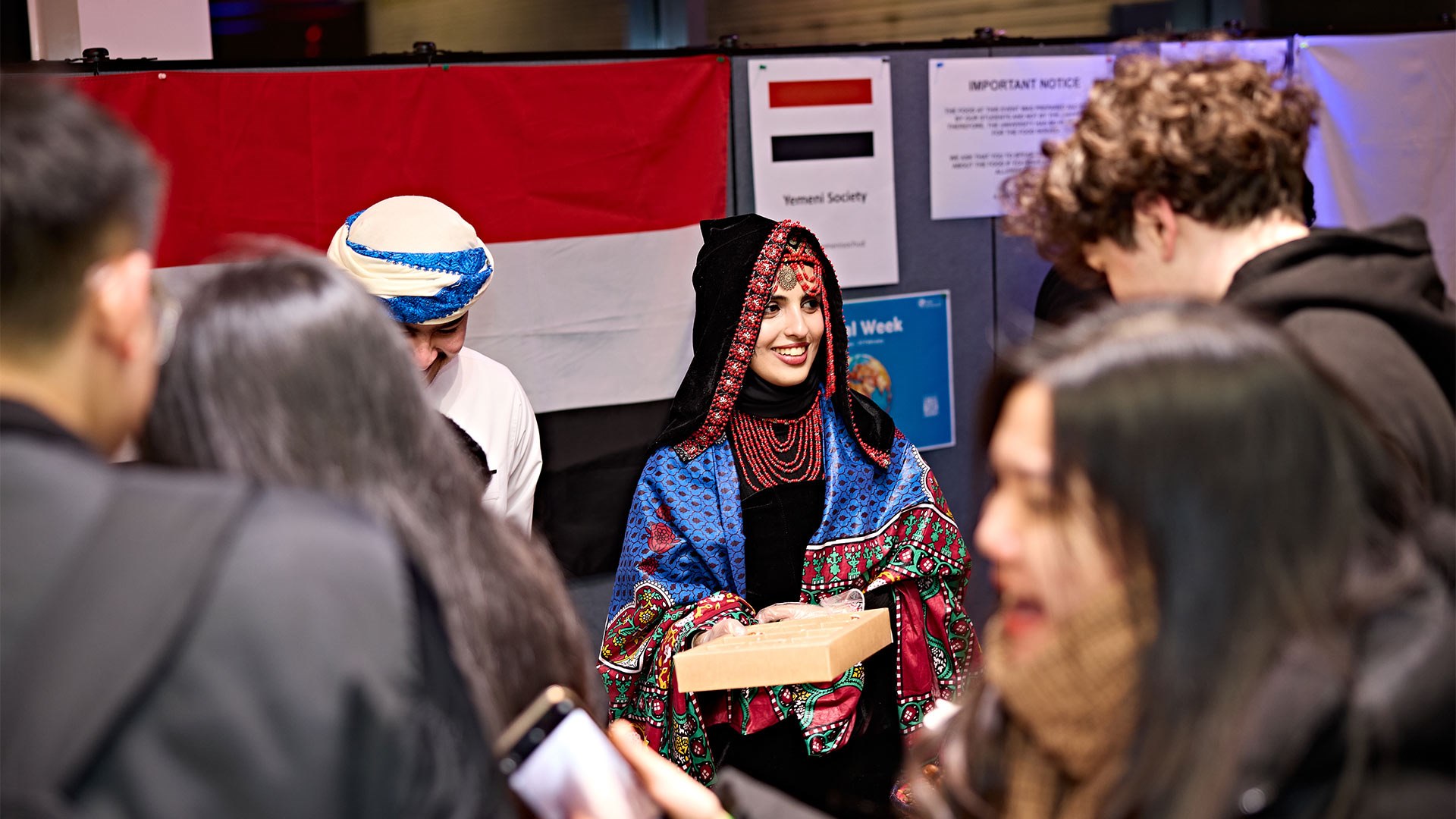 A person in traditional dress at a food festival