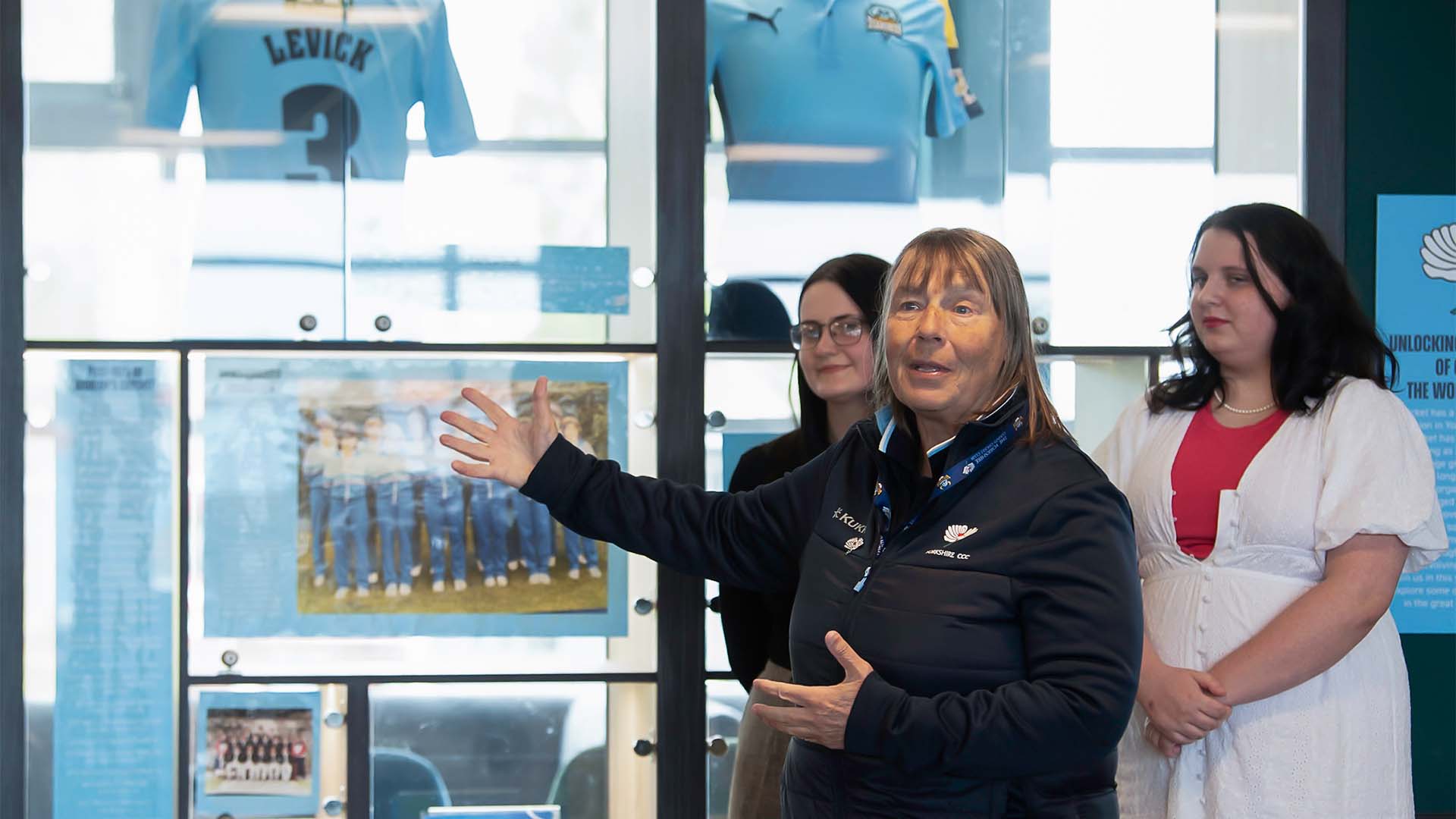 Jane Powell speaks in front of the cricket display at Headingley