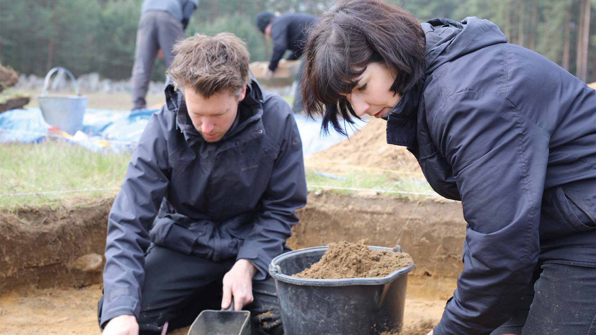 Archaeologists Will Mitchell and Caroline Sturdy Colls on a dig at Treblinka