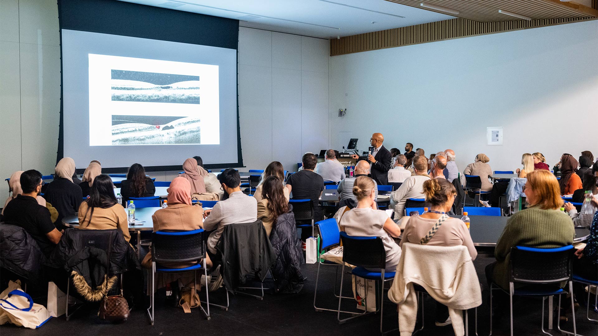 A group of people at a conference