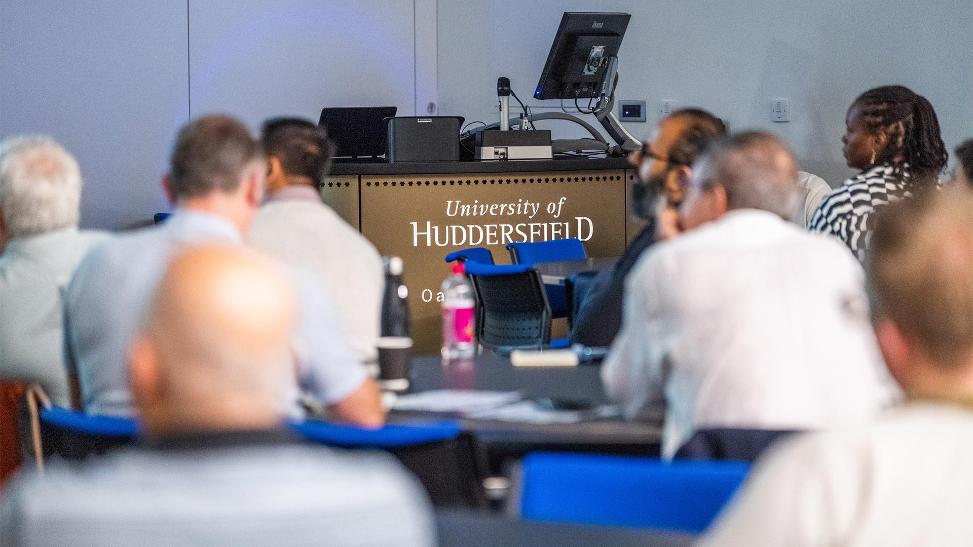 people in a lecture theatre at a conference