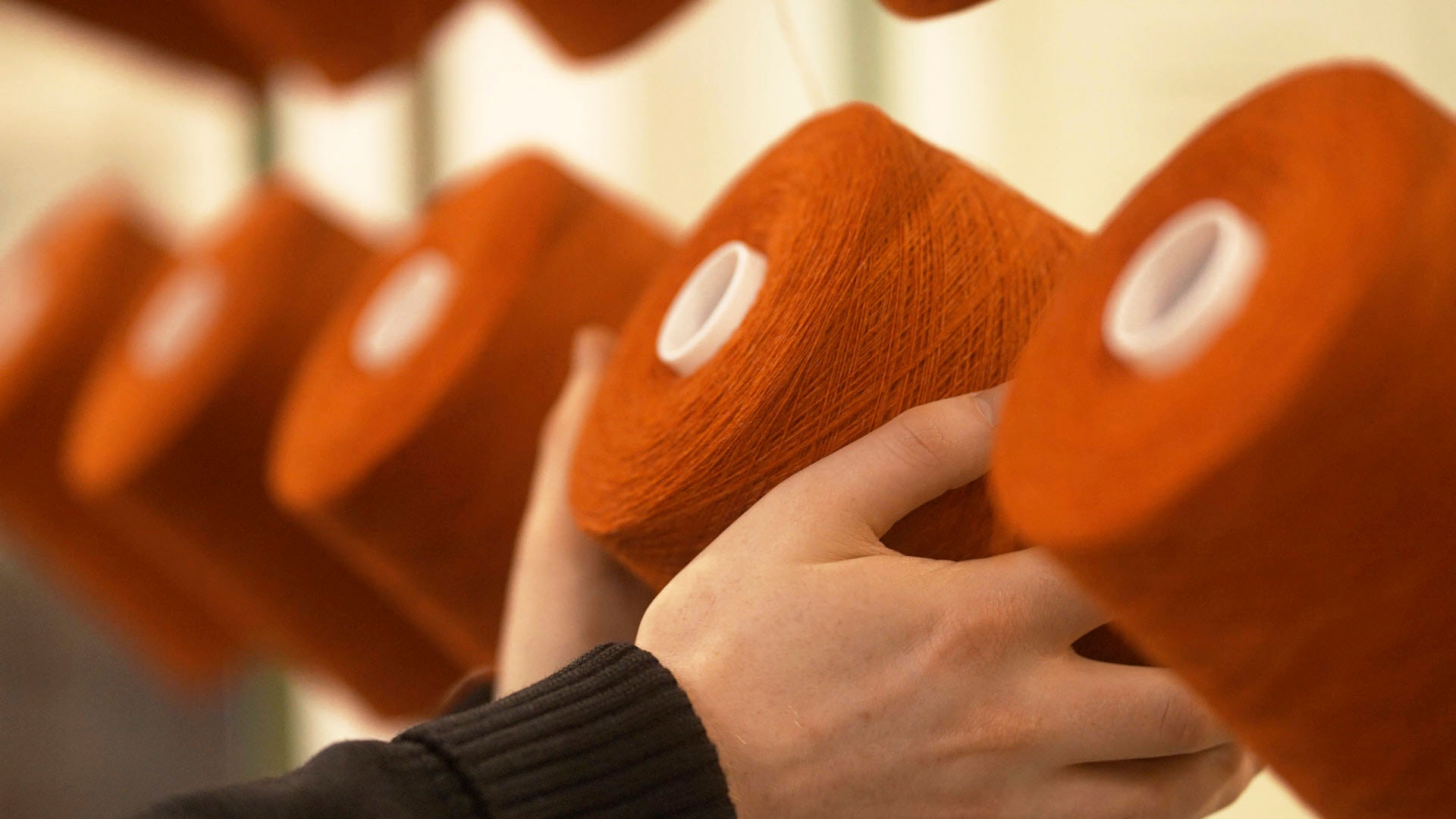 Some spools of red thread in close up
