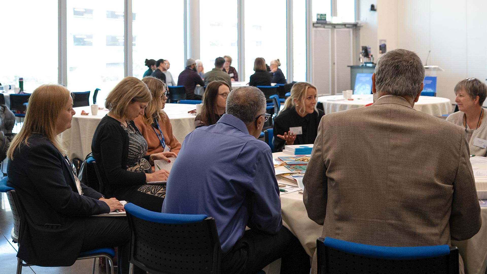 A group of people gathered at a UNESCO event at the University of Huddersfield