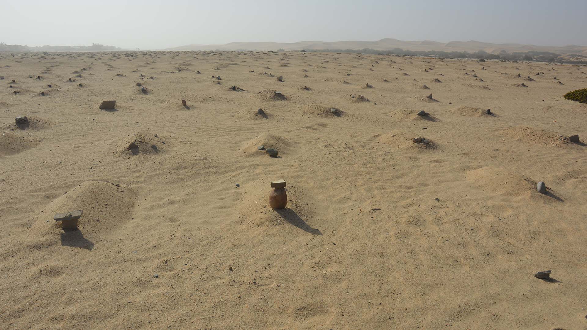 Graves, marked by small sand mounds, in a slave cemetary in Namibia