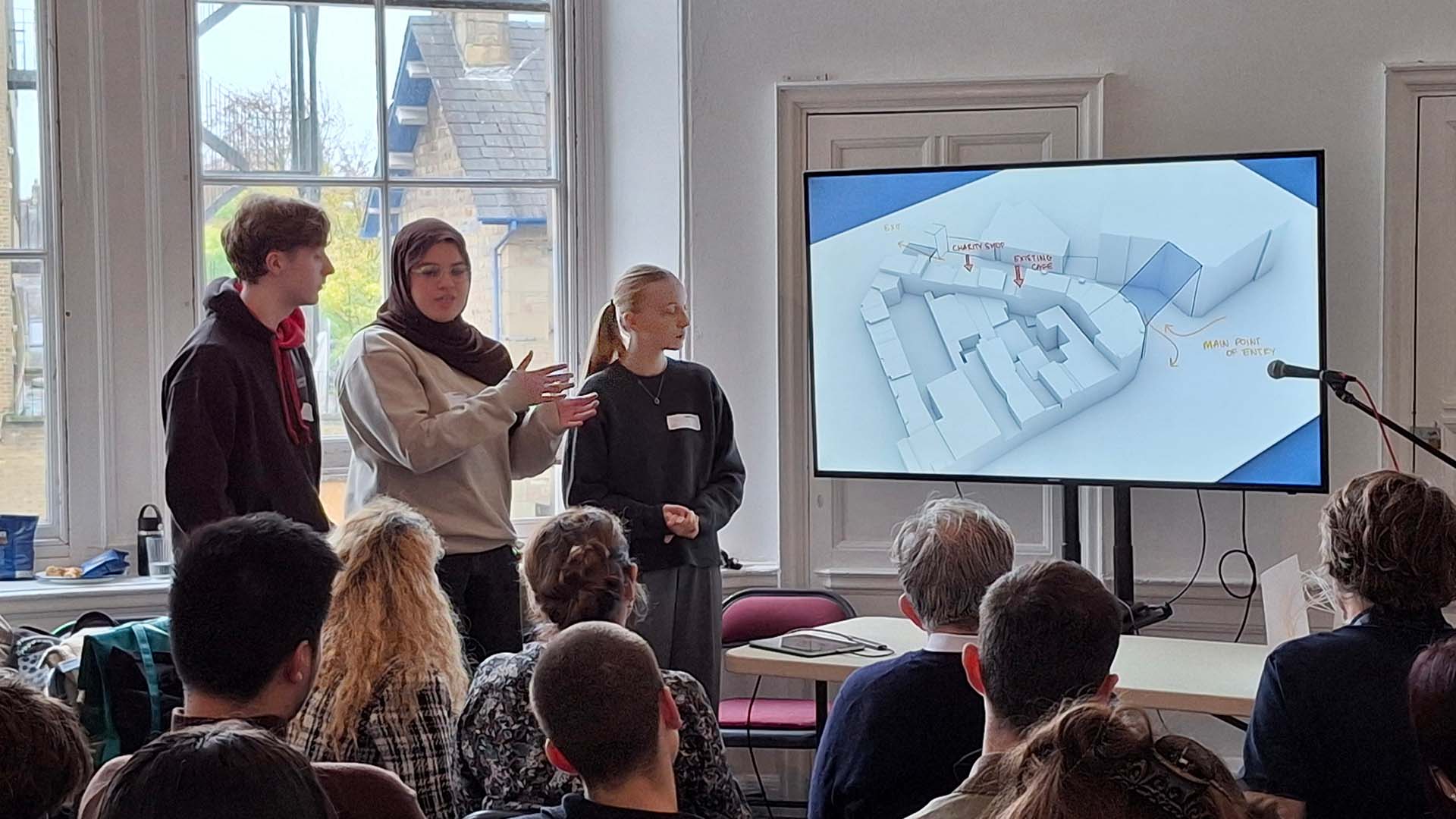 Asma and her group in Lancaster present their designs on a screen