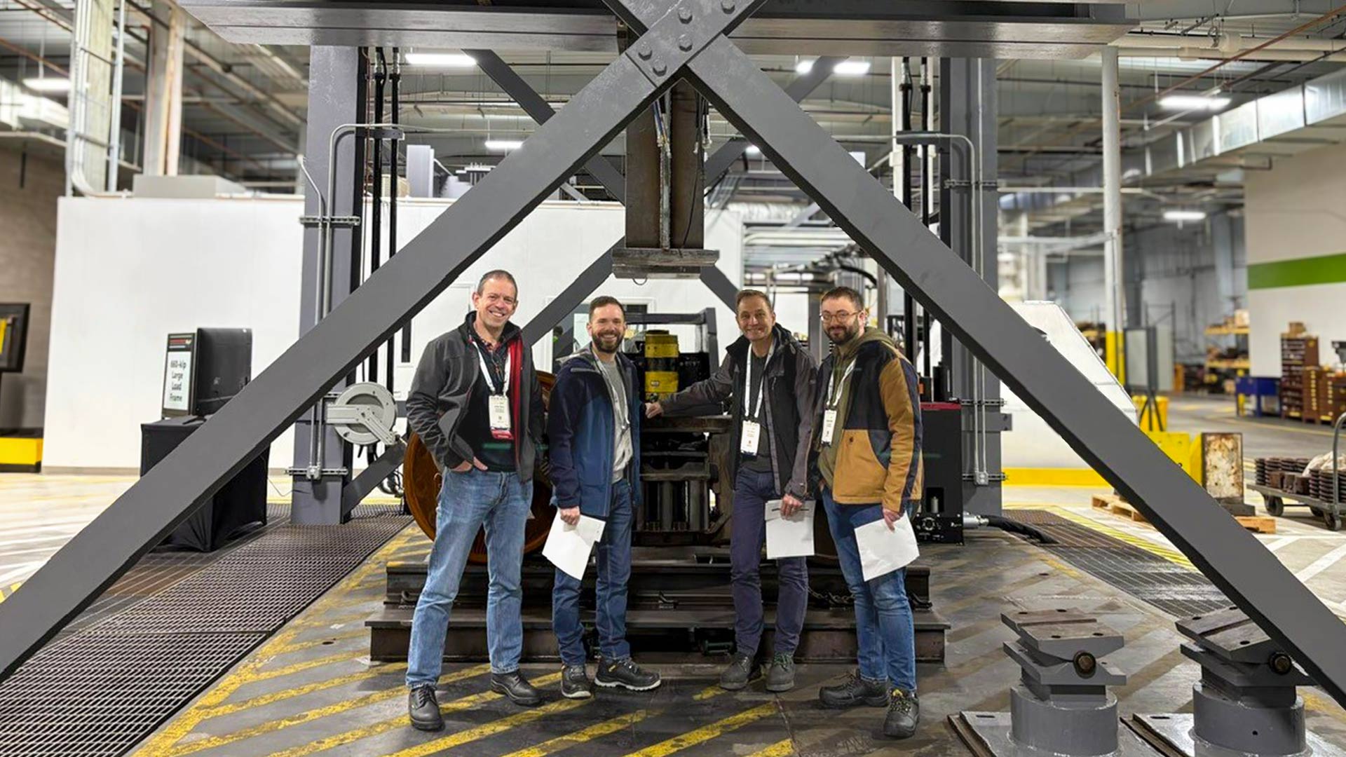 A group of men standing at a rail conference