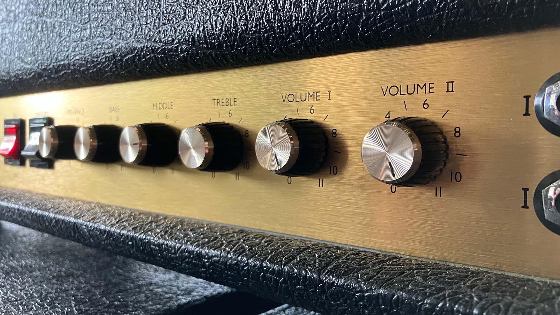 A close up of the amp that shows on its dials that it goes up to 11