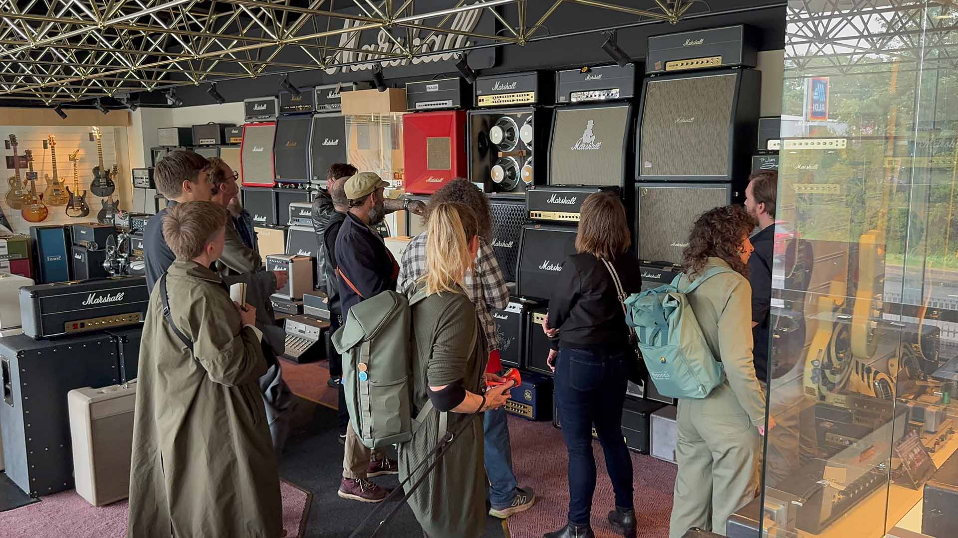 Researchers look at some Marshall Amps and equipment