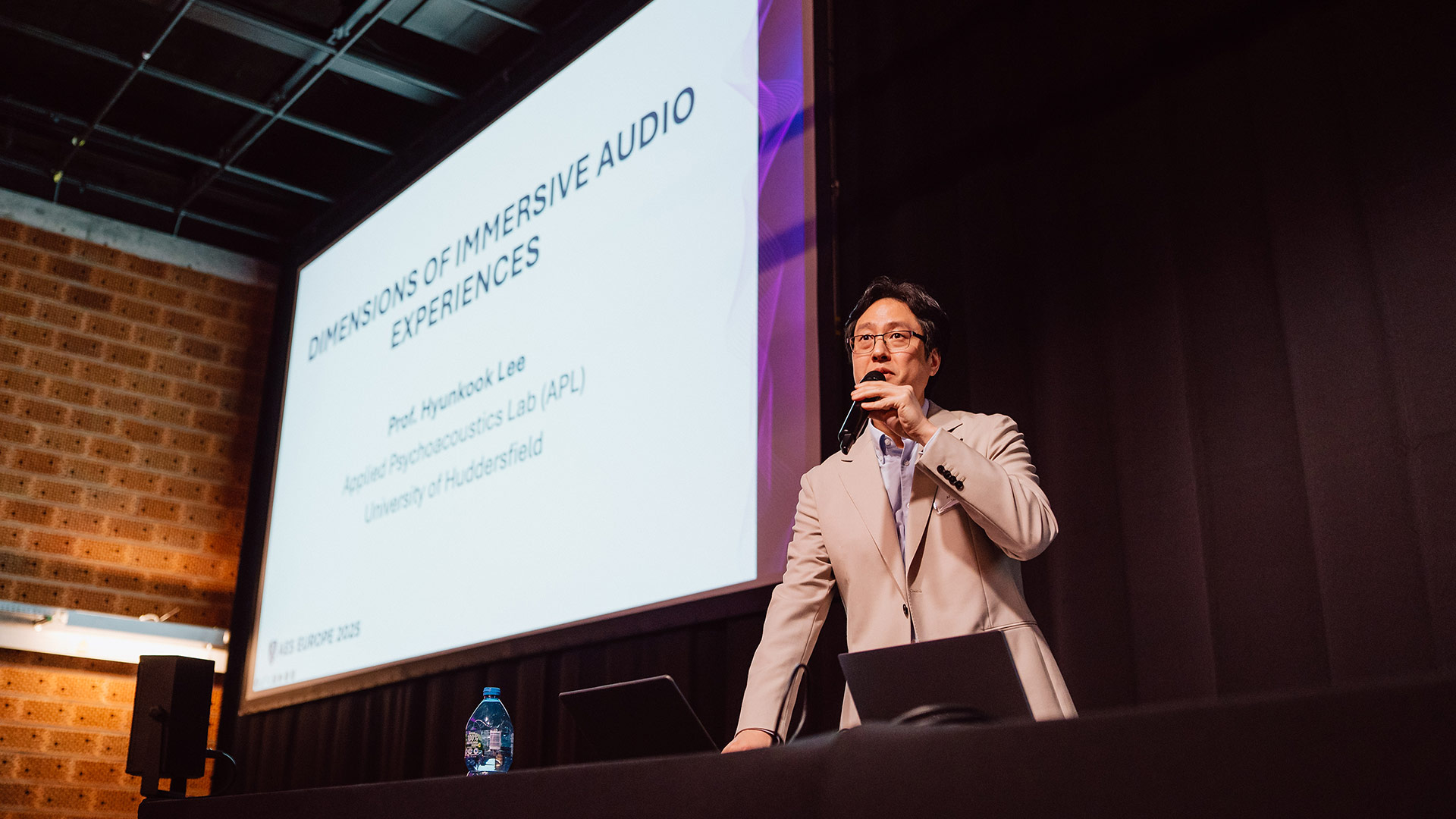 Professor Hyunkook Lee speaking at a convention