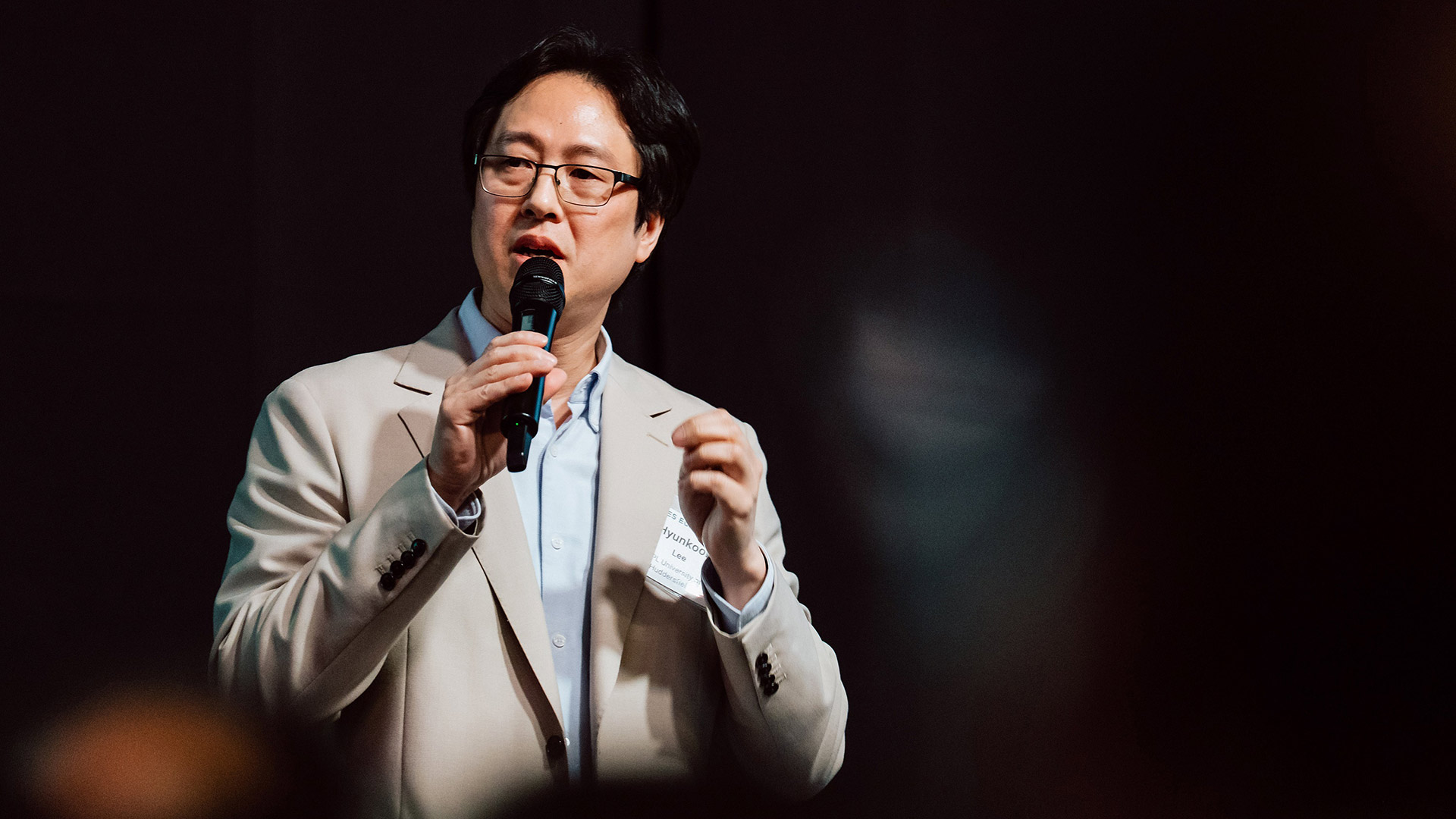Professor Hyunkook Lee speaking at a convention
