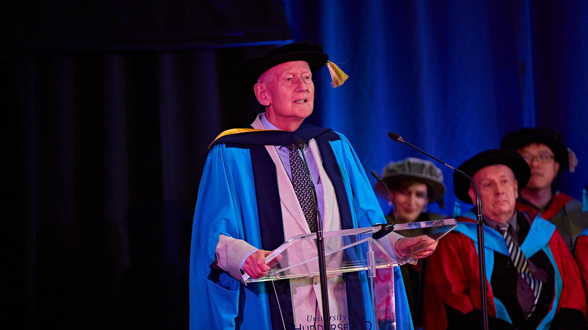 Barry Sheerman on stage receiving an honorary doctorate
