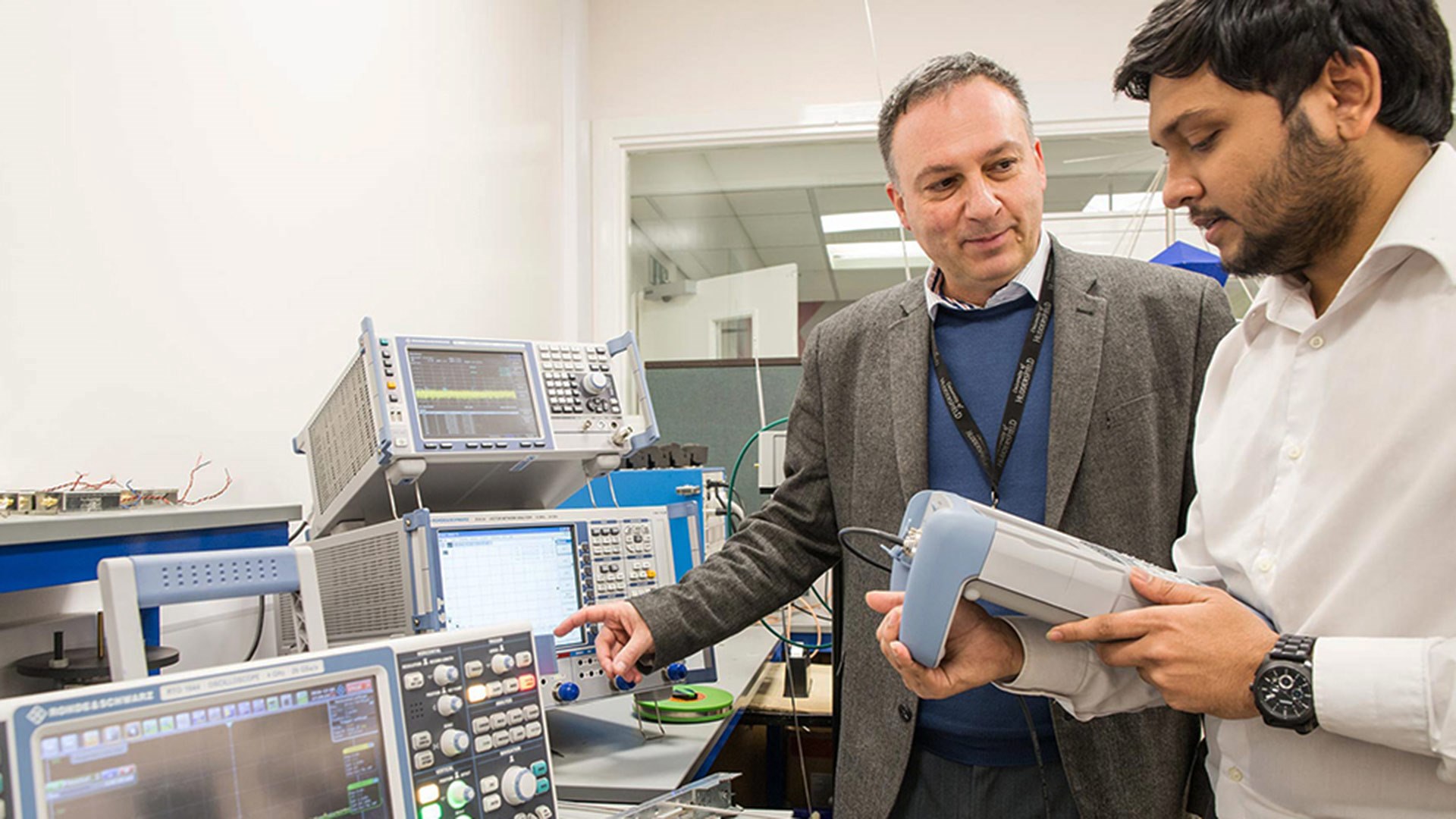 Two men in a lab with equipment