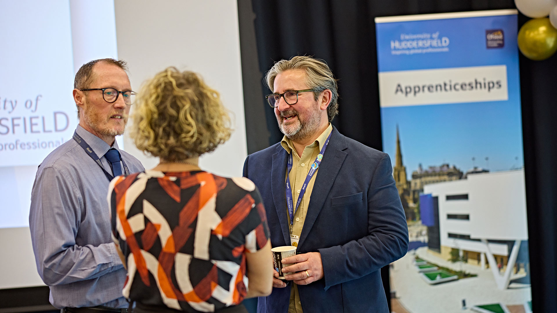 A group of people chatting at an event