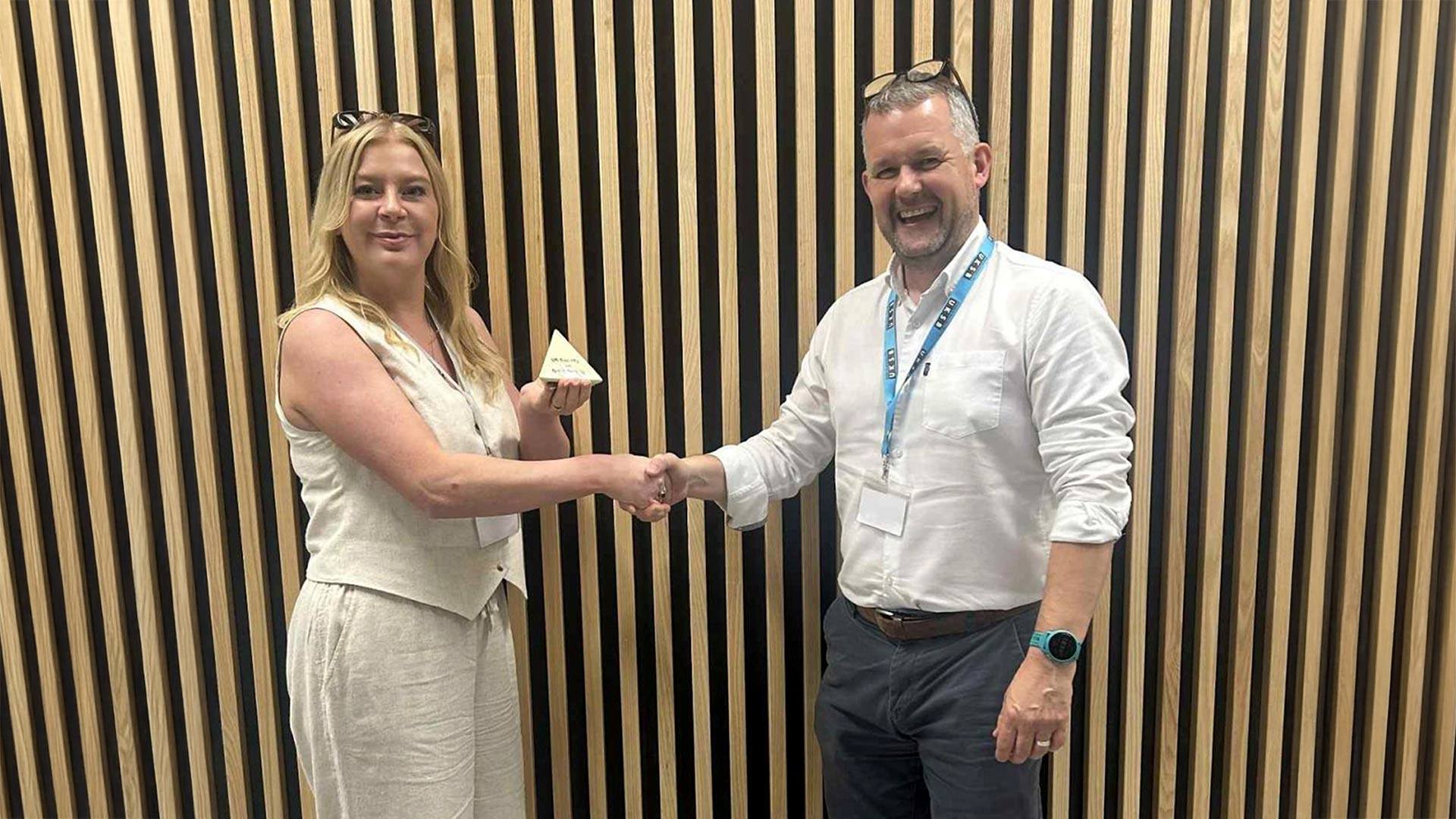 Dr Jessica Senior receiving an award