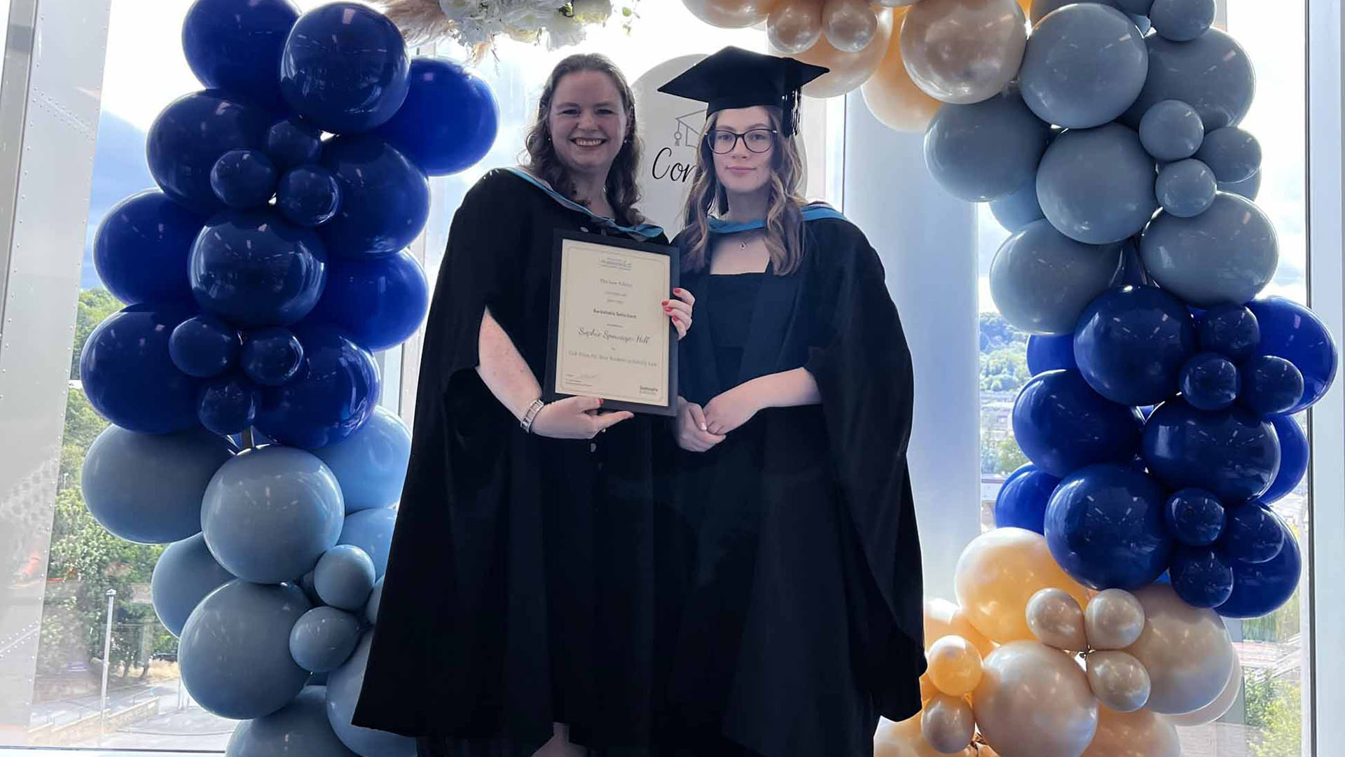 Sophie receiving a law award