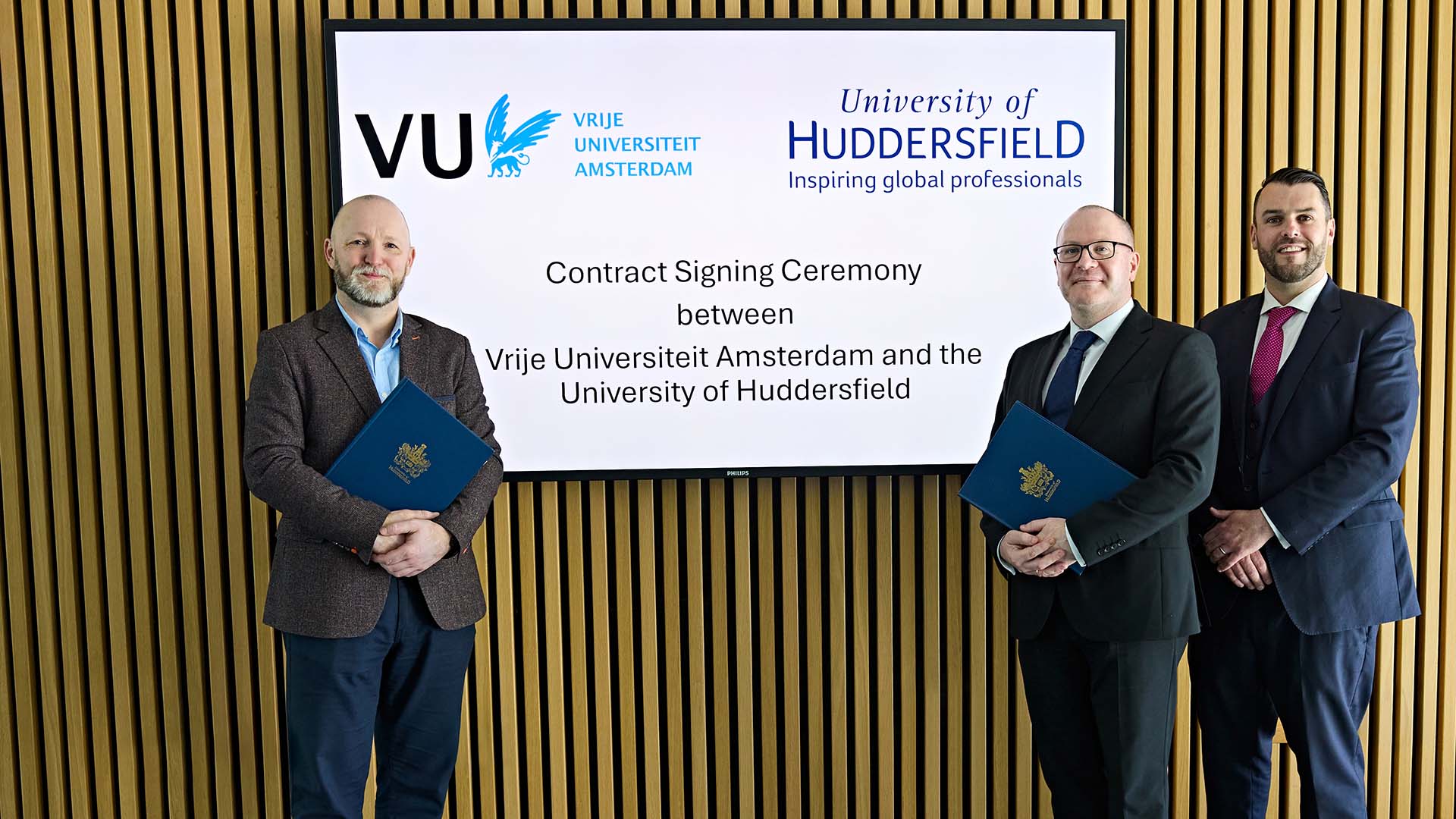 People from Huddersfield and VU Amsterdam stood in front of a screen
