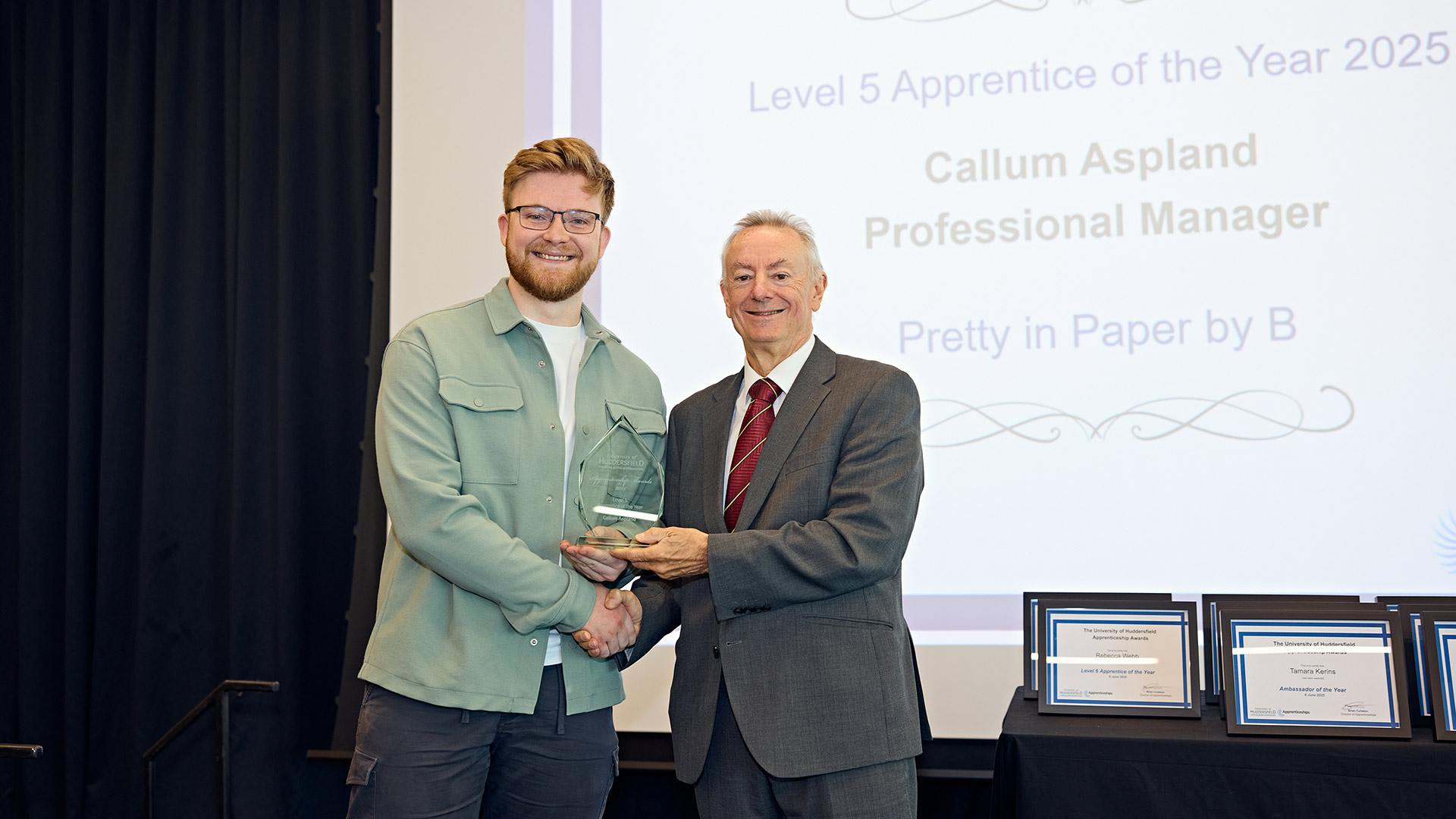 A man receiving an award on stage