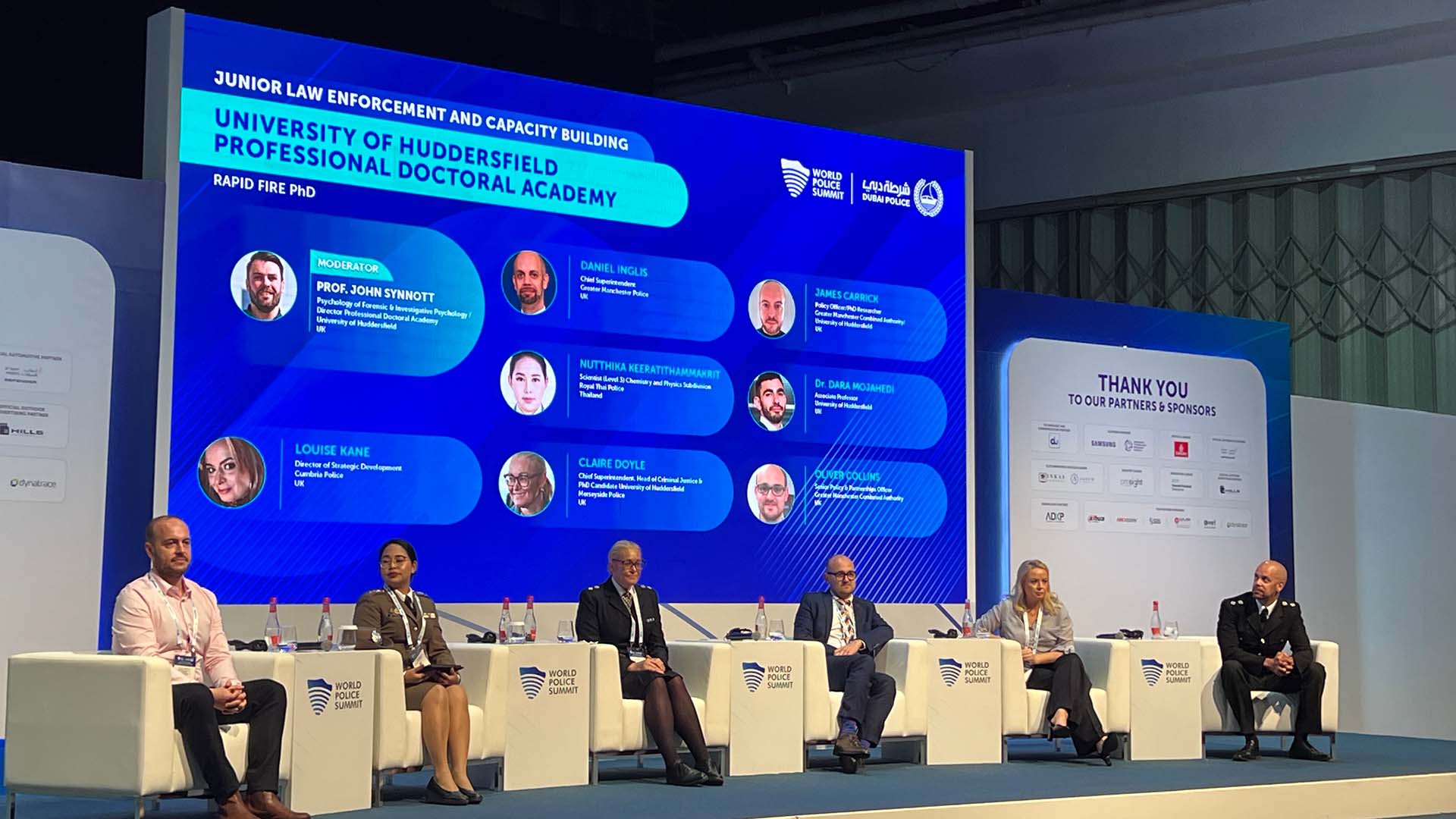 Police Doctoral Academy group on stage in Dubai