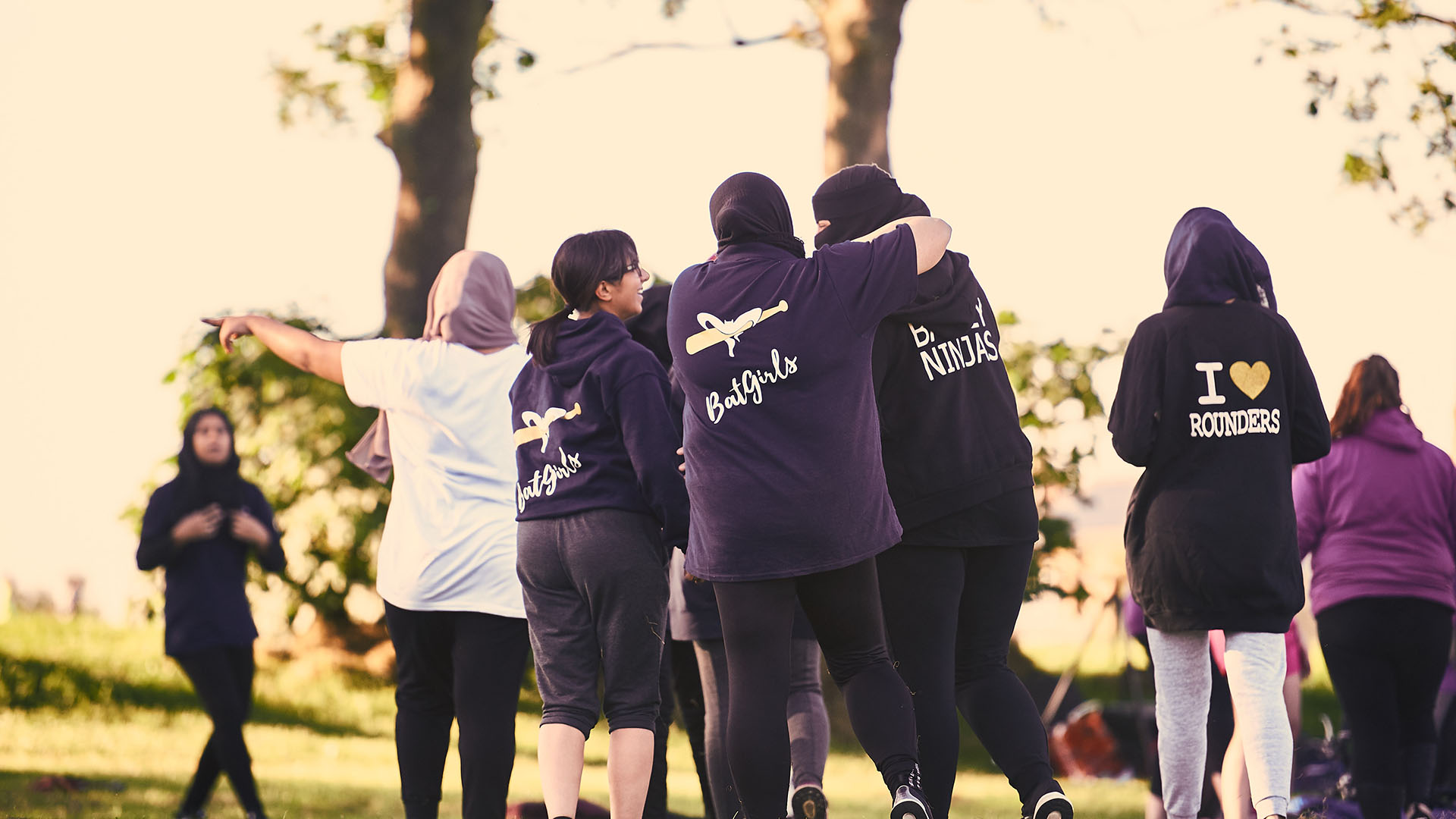People playing rounders