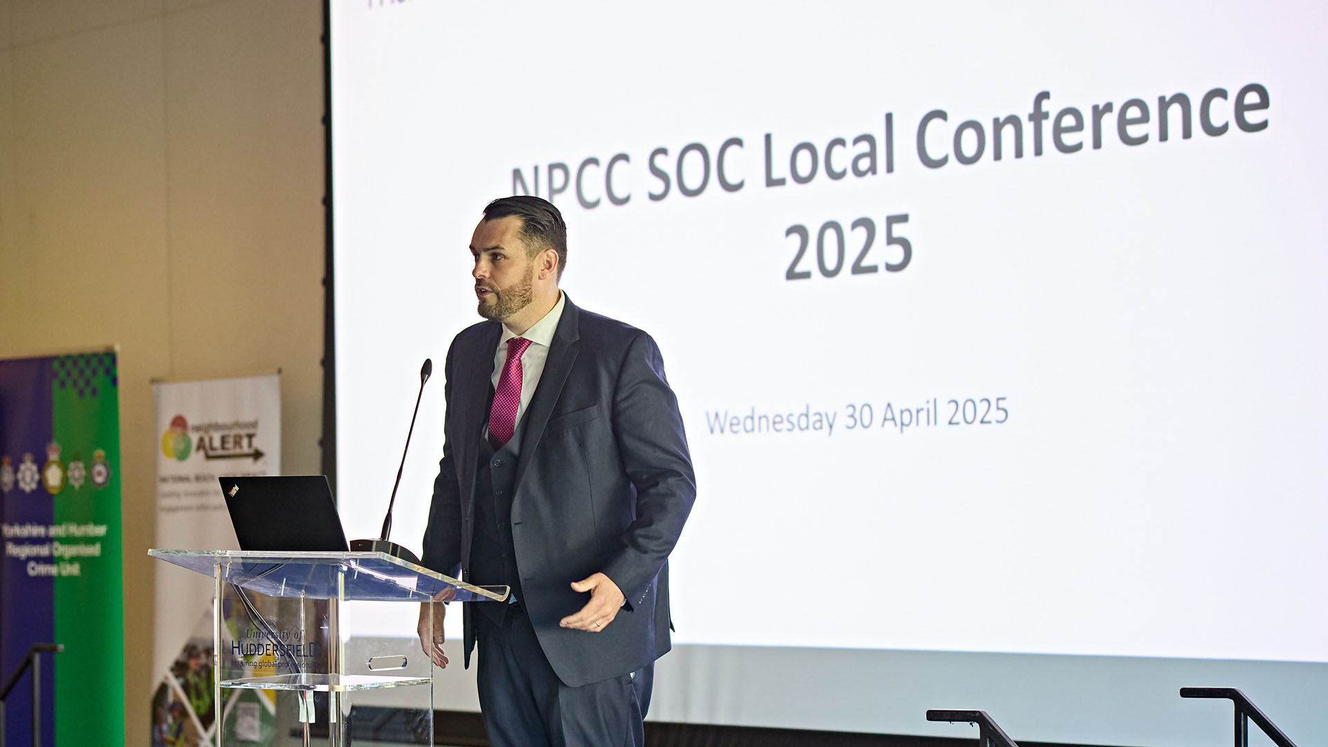 John Synott speaking at a conference