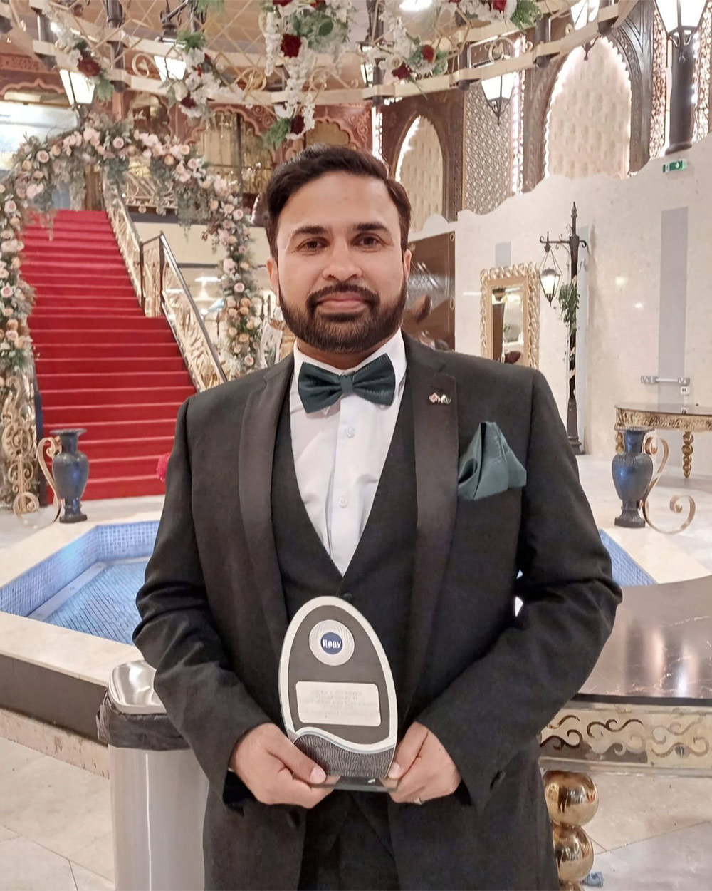 A man holding an award