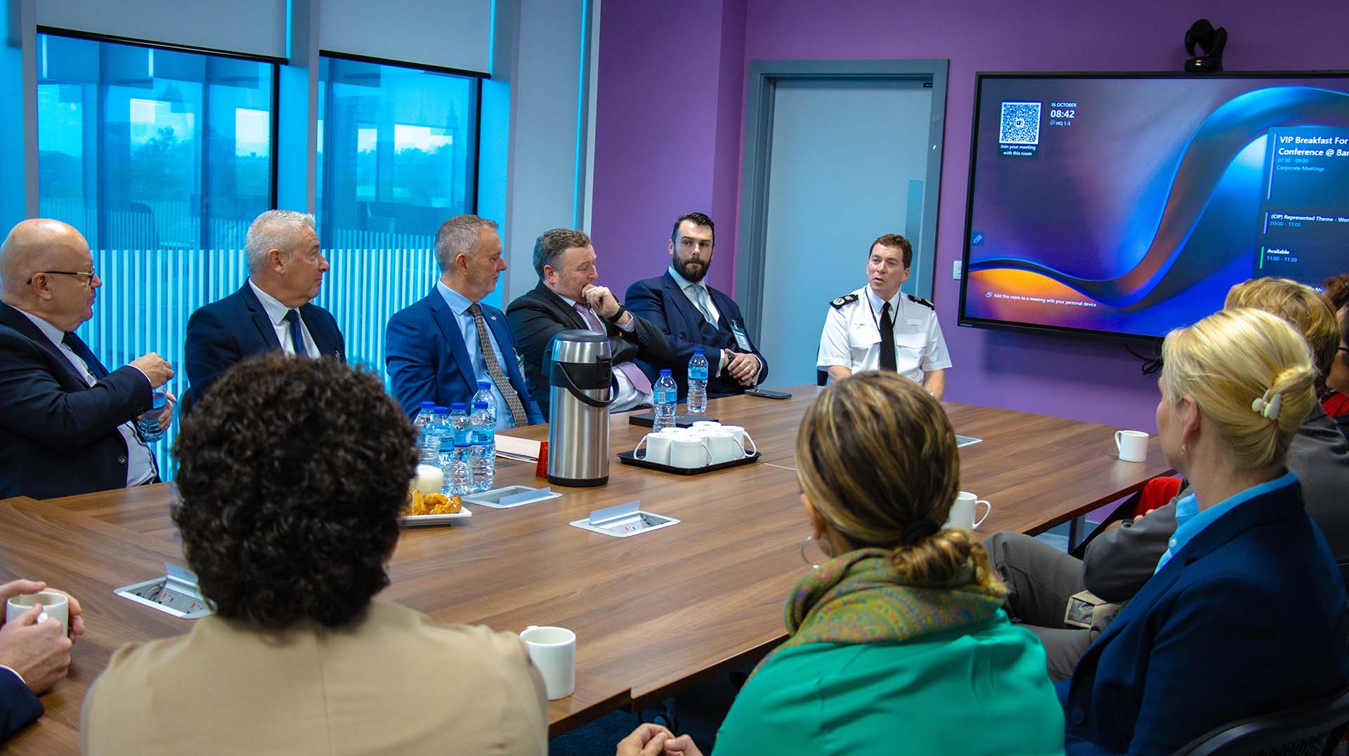 Delegates sat around the table at the conference