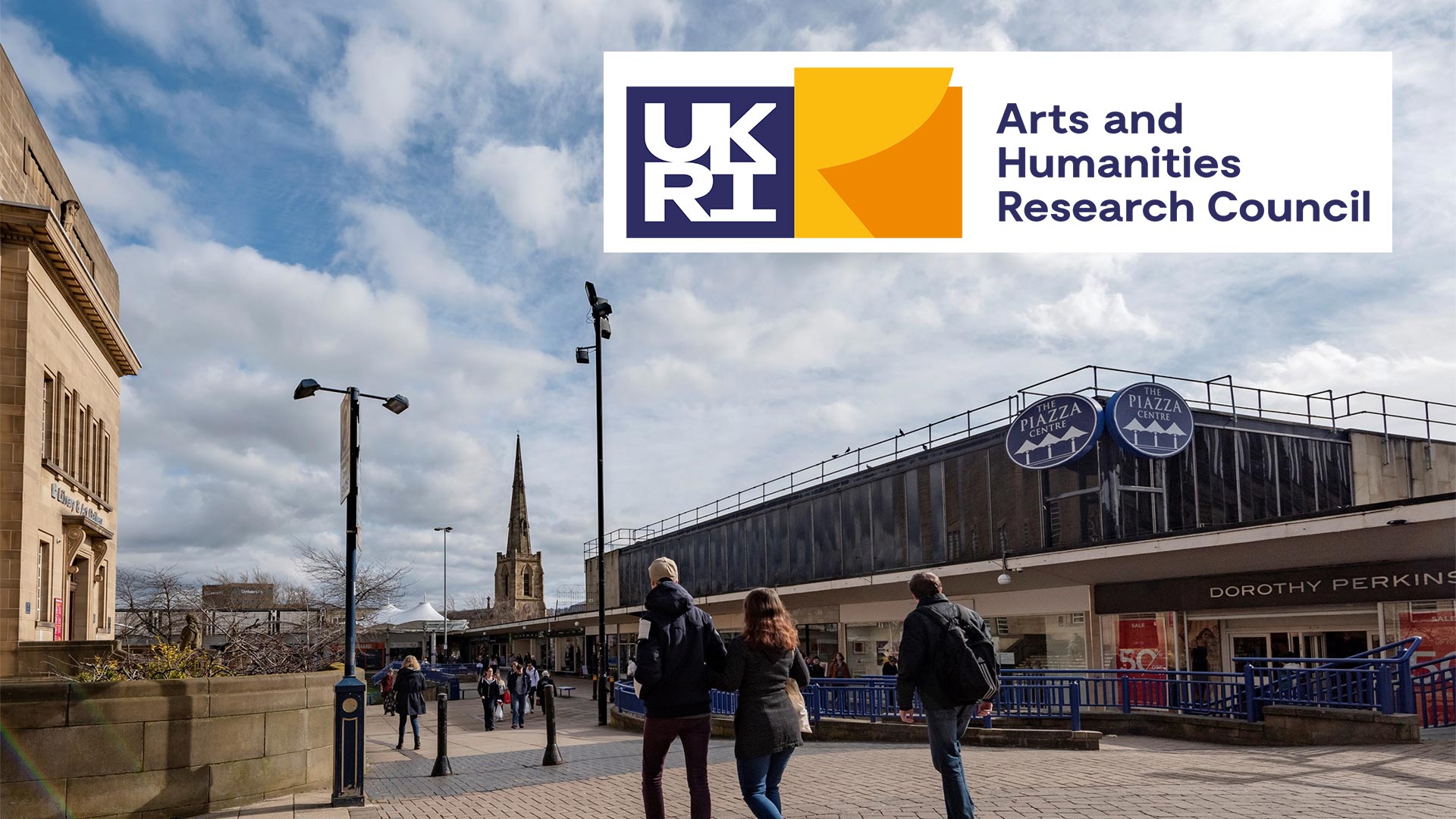 An outdoor area with the AHRC logo over it