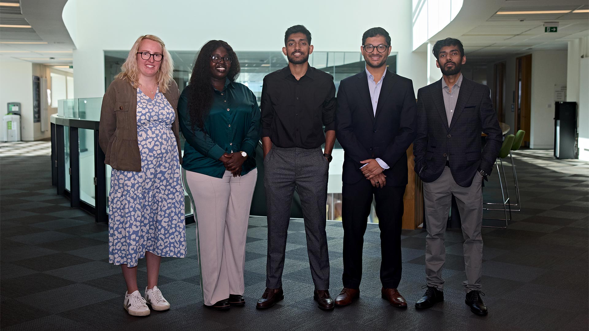 a group of students with a business woman