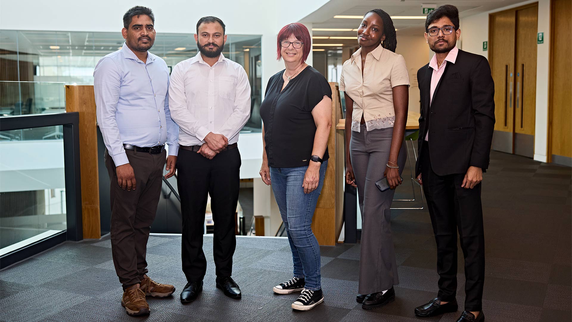 a group of students with a business woman