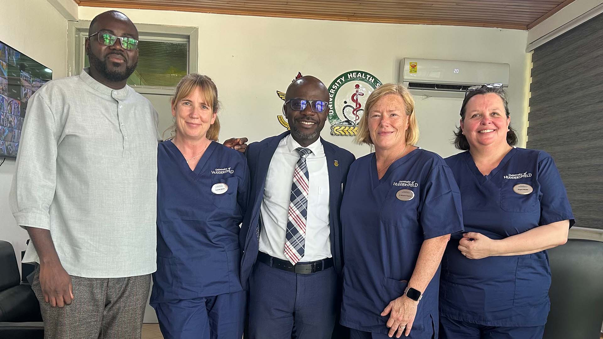 Staff from Huddersfield and Kwame Nkrumah University of Science and Technology smile at the camera