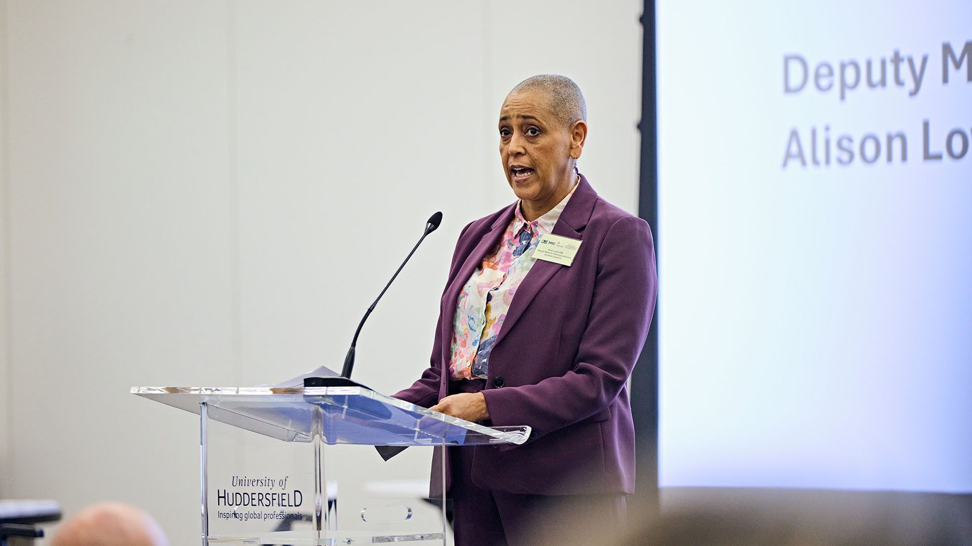 Alison Lowe speaks while standing at a lectern, yesterday