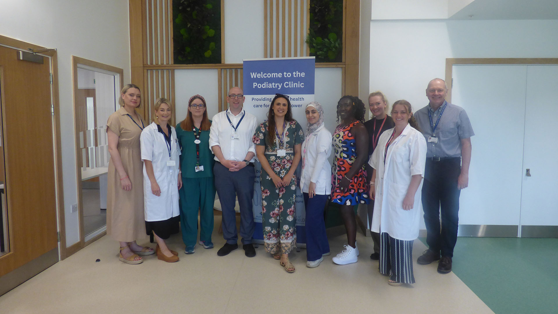 Members of the podiatry team stand outside the Podiatry Clinic