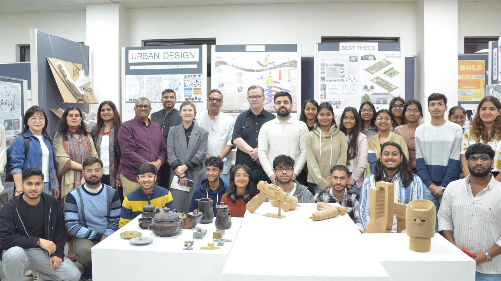 Delegates at a conference in India smile at the camera