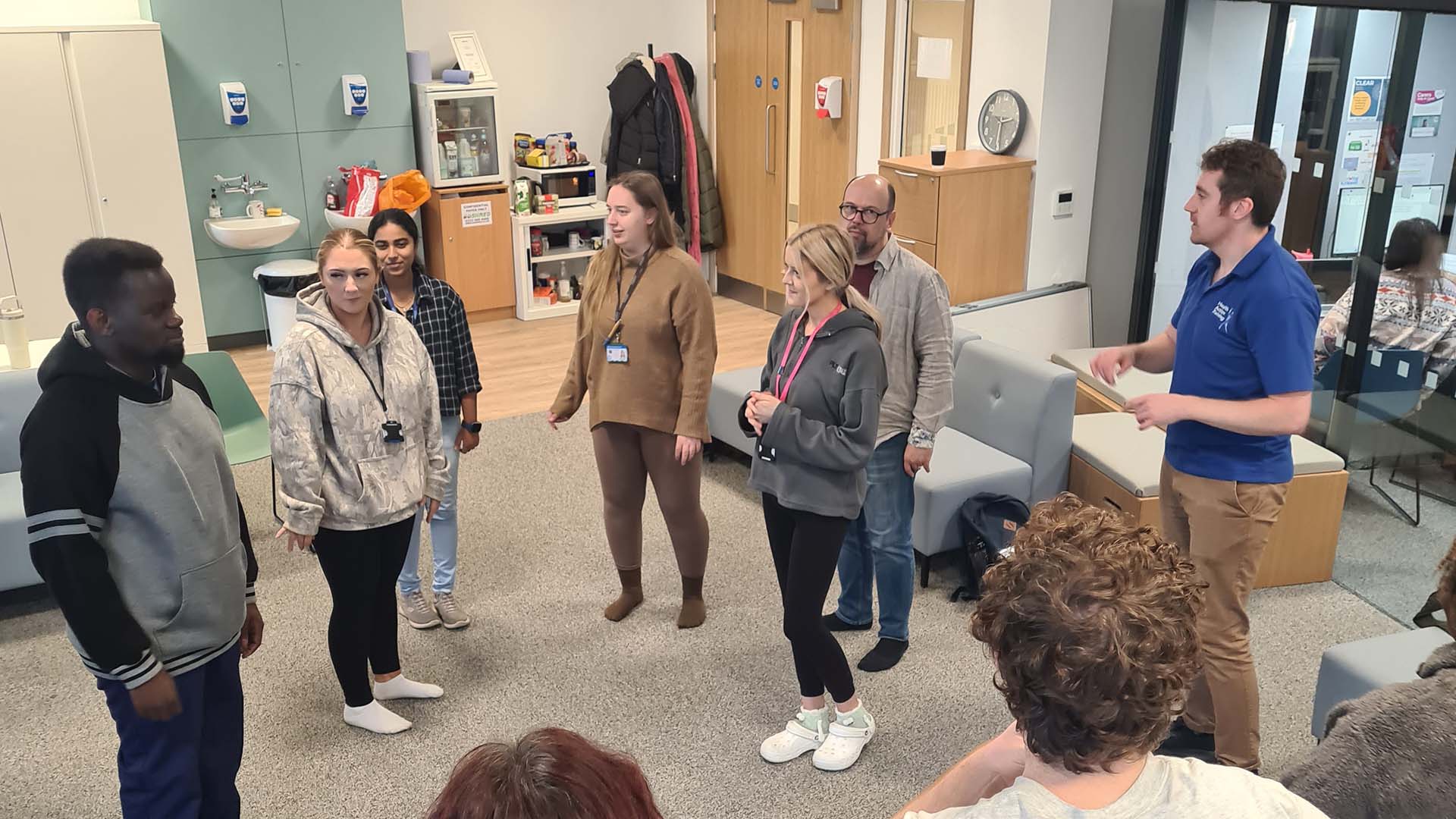 Nursing students perform a role-playing scenario