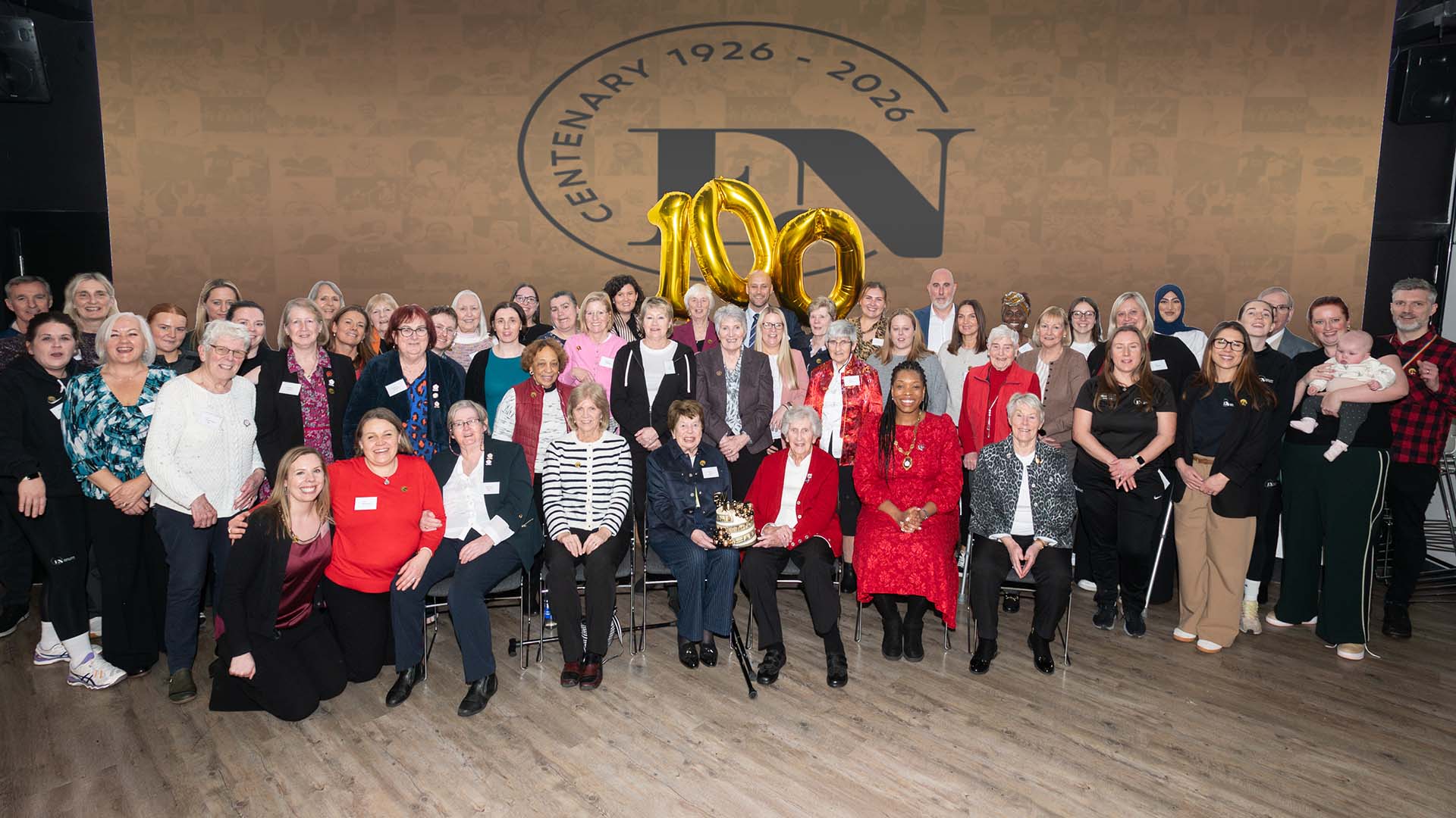 A large group of people at the Heritage QWuay netball exhibition launch
