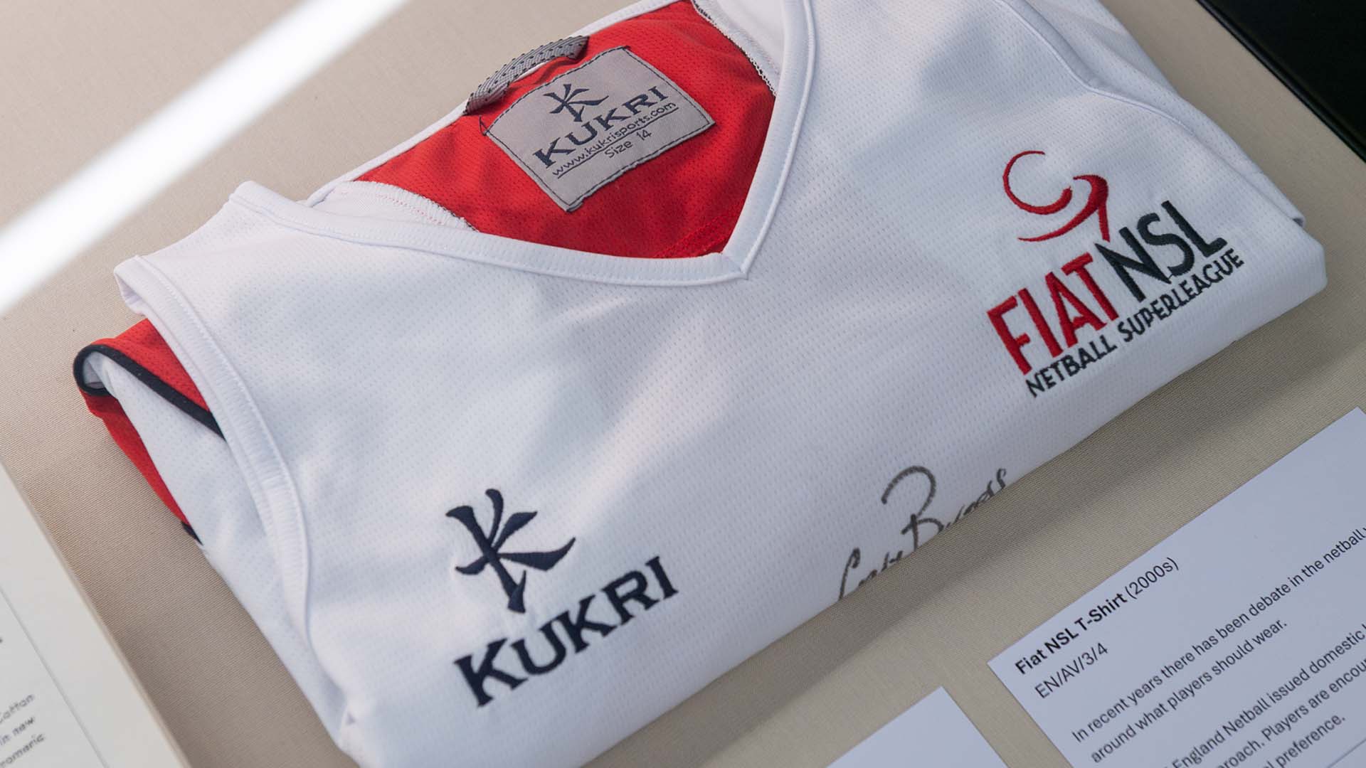 A netball shirt in a cabinet